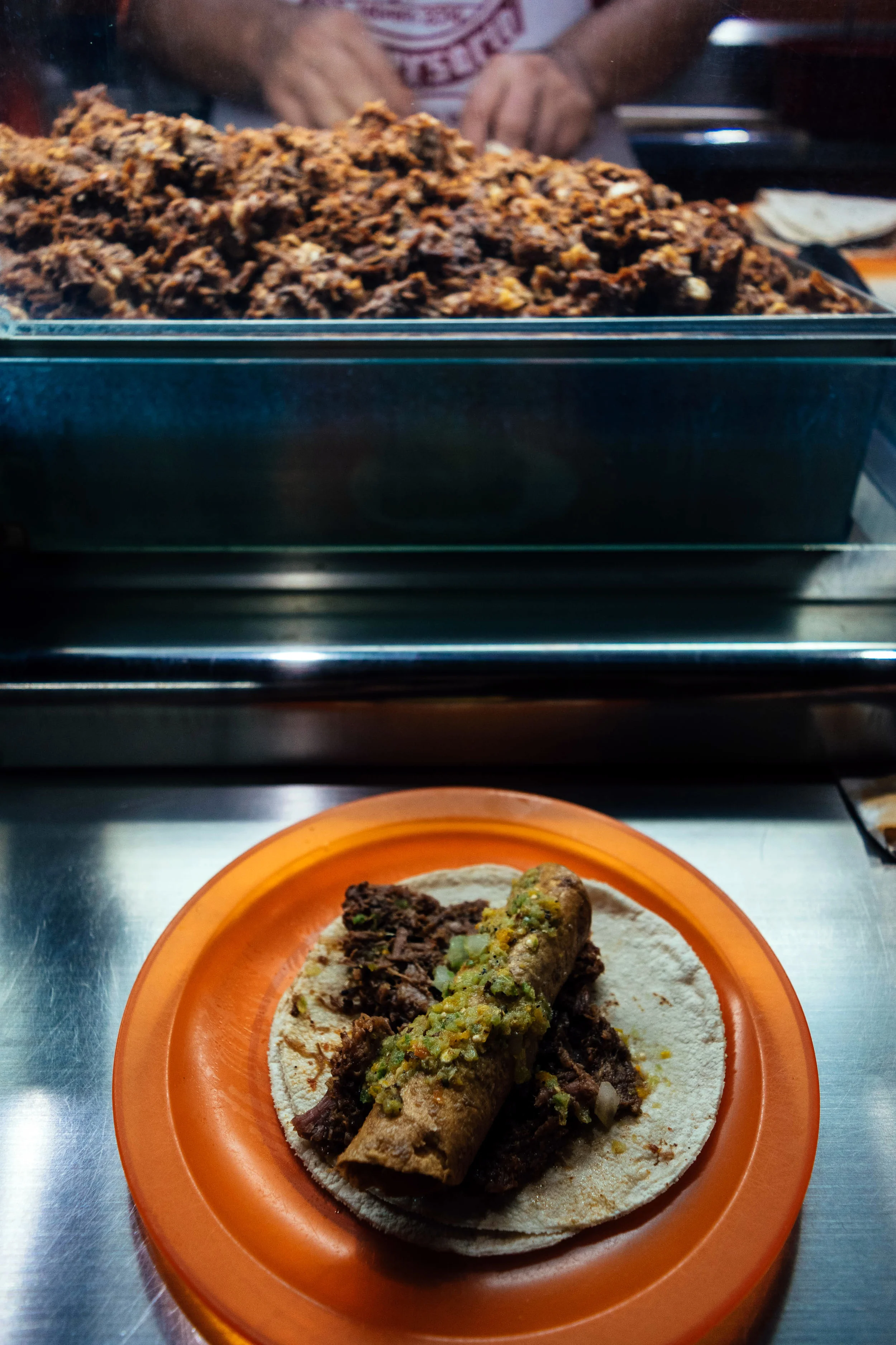 Goat barbecue taco with tantarria (mesquite bug) sauce.