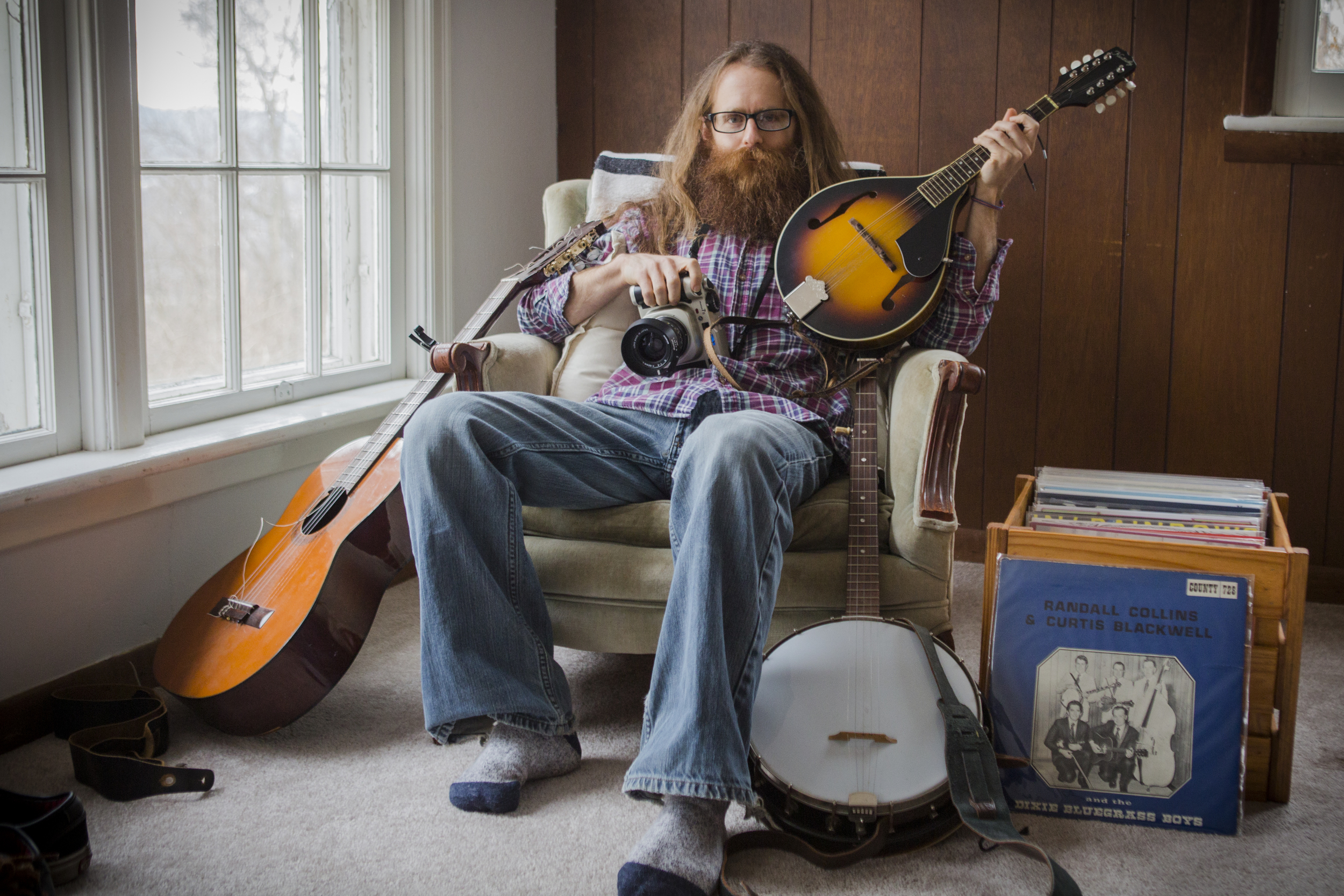  Josh Birnbaum, a photographer and musician,&nbsp;in his Athens, Ohio, home on Jan. 23, 2015. Birnbaum recently received funding for a project to document bluegrass music culture in Appalachia on film. 