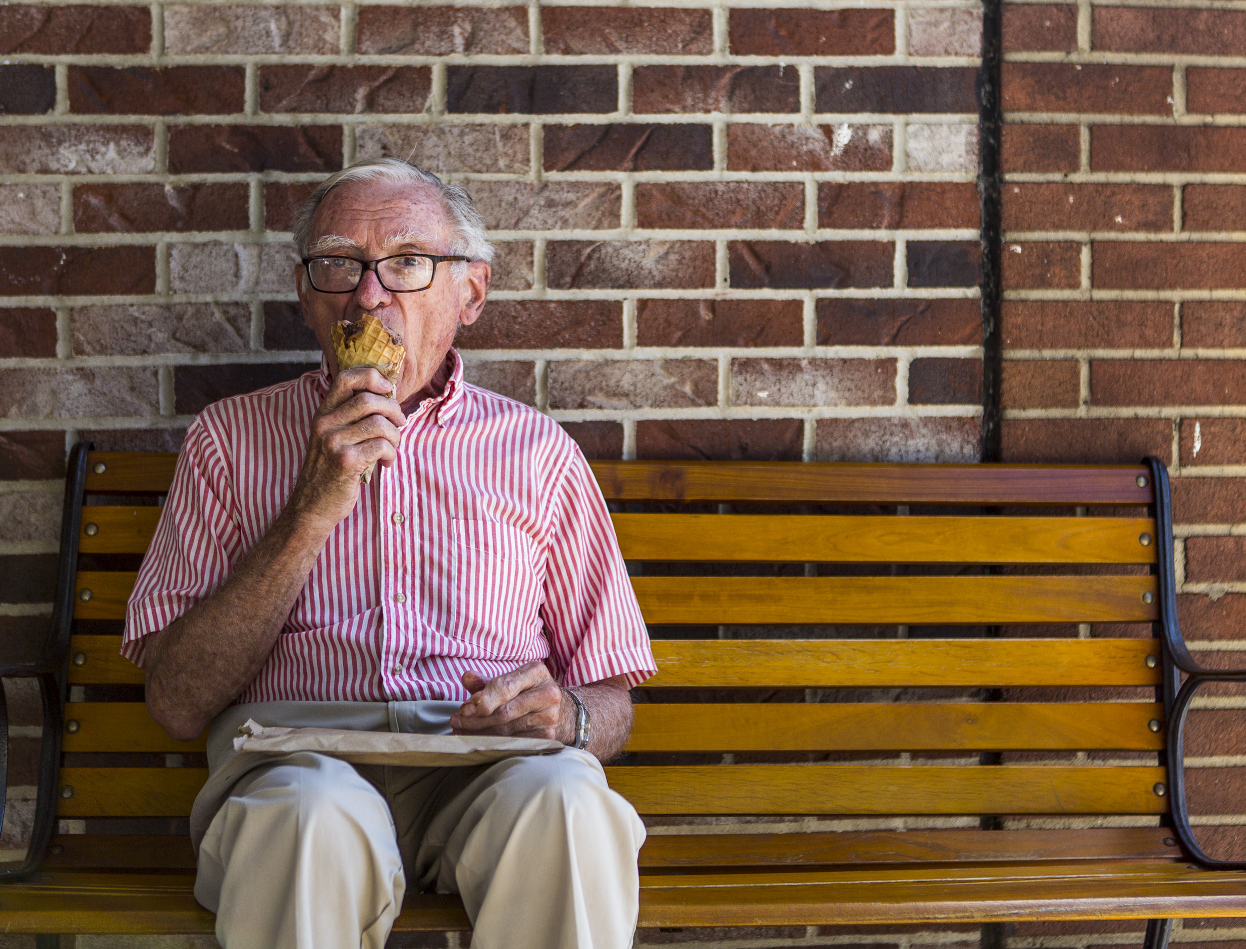  Tom Hitner of Ligonier, 82, enjoys his ice cream from the Ligonier Creamery on Monday, July 11, 2016. Hitner has lived in Ligonier for most of his life and goes to the creamery whenever he happens to walk by. 