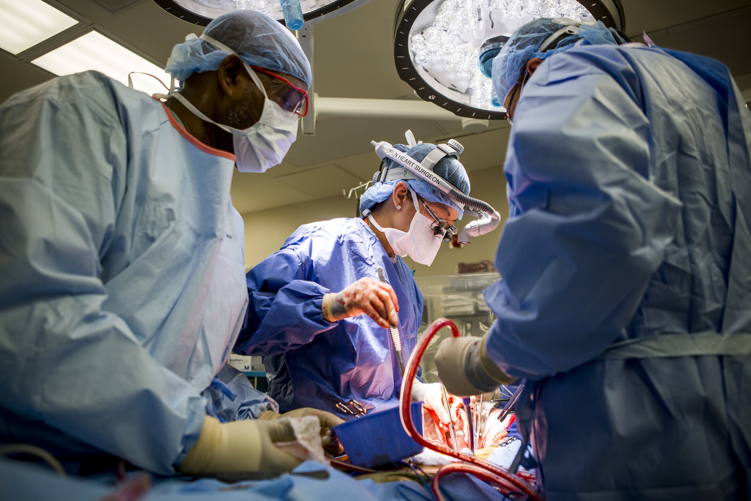  Dr. Quynh Feikesm, center, performs a surgery to fix an abdominal aneurysm with assistance from John Cousett, left, a Certified Heart Scrub Tech and assistant Tracy Blankenship at University Medical Center on Tuesday, May 23, 2017. Dr. Feikes is the