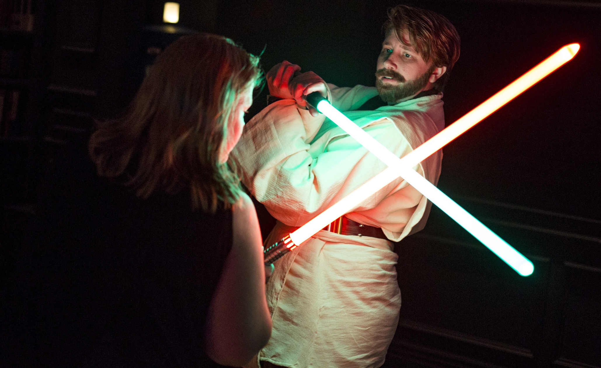  Amanda Bond, left, and Rebecca Zobell, dressed as Obi Wan Kenobi, practice their lightsaber skills as they celebrate the 40th anniversary of the release of Episode IV – A New Hope at the Millennium Fandom Bar in the Arts District on Thursday, May 25