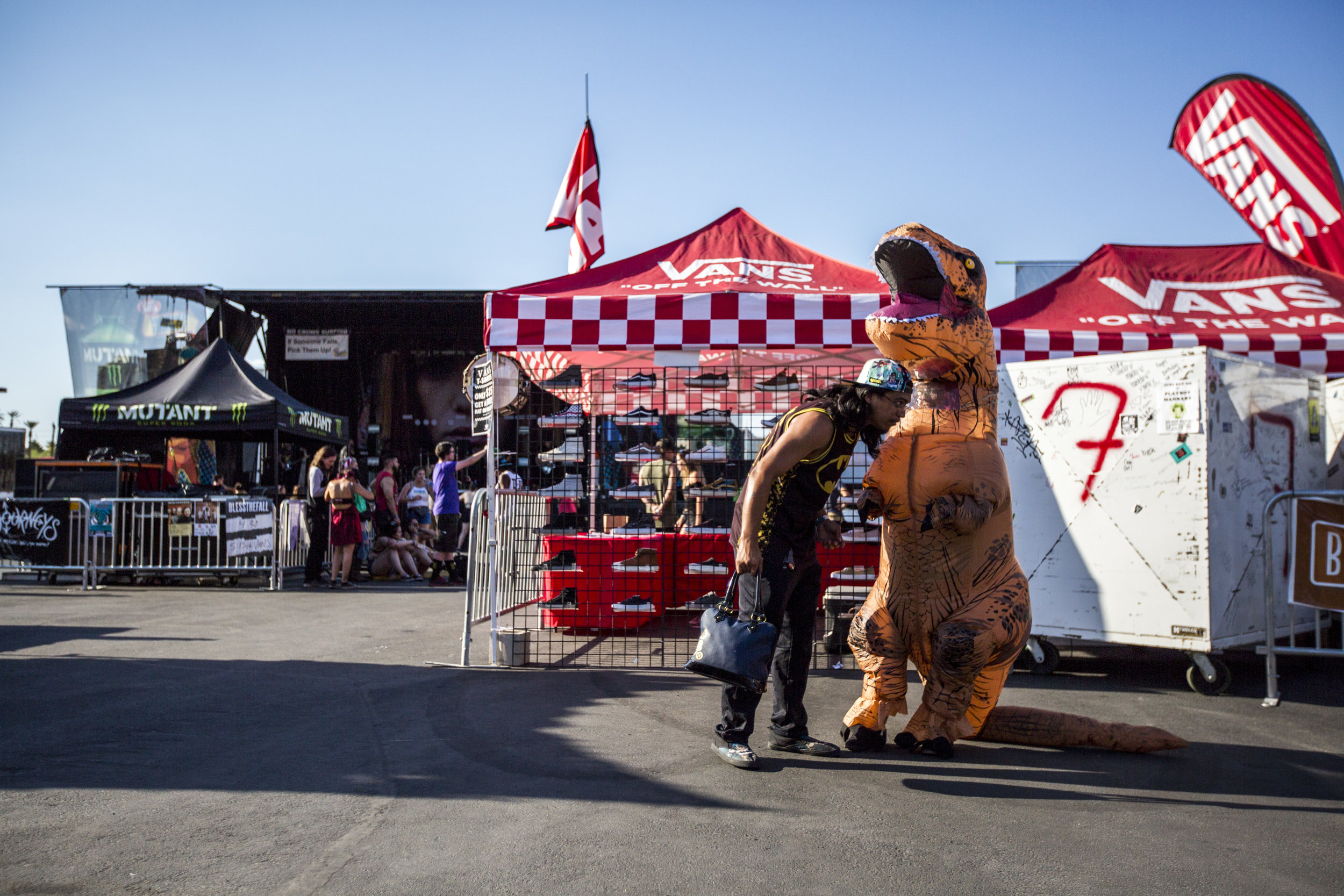  Larry Sanroman checks on his friend Jennifer Paddock in her dinosaur costume at Vans Warped Tour at the Hard Rock Hotel and Casino on Friday, June 23, 2017.  Patrick Connolly Las Vegas Review-Journal @PConnPie 