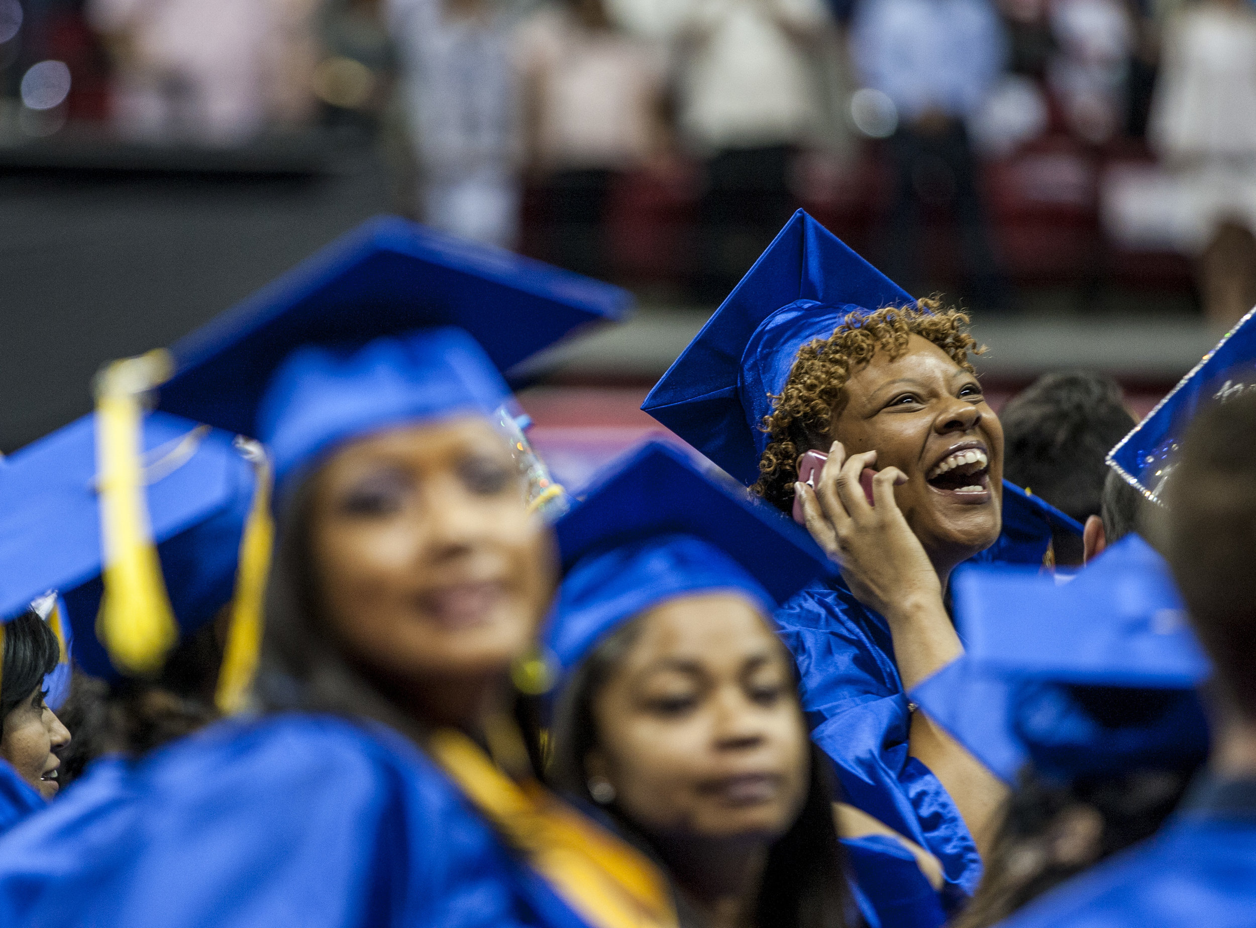  A College of Southern Nevada graduate talks with an audience member on the phone before the start of commencement at the Thomas and Mack Center in Las Vegas on Monday, May 15, 2017. 