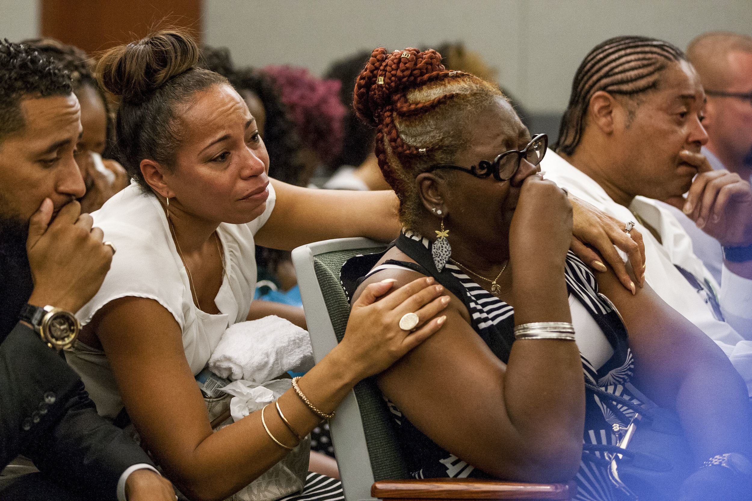  Ramona Gantz, center left, comforts Debra Pleasant, center right, the grandmother of Roland Pleasant, during the sentencing for Eric Javon Bell, who pleaded guilty to killing 18-year-old Roland Pleasant, at the Regional Justice Center in Las Vegas o