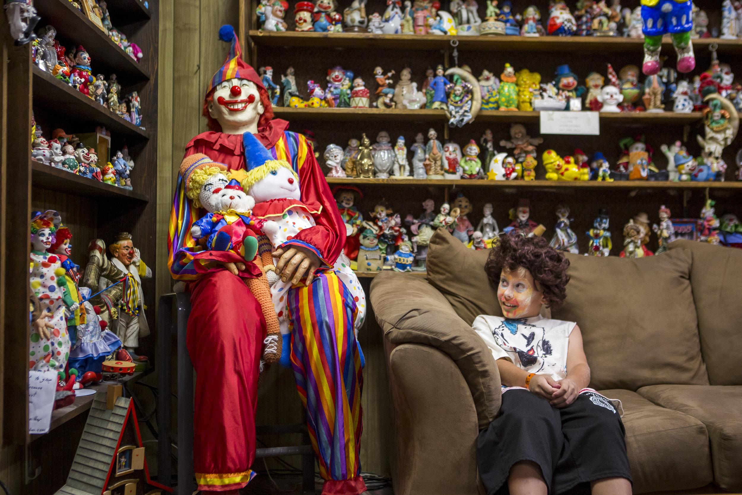  Kai James, 9, glances over at the life-size clown known as "Mr. Creepy" in the lobby of the Clown Motel in Tonopah, Nevada, on Tuesday, July 25, 2017. James came with his brother and mom from Las Vegas to stay for a night and dressed up in clown att