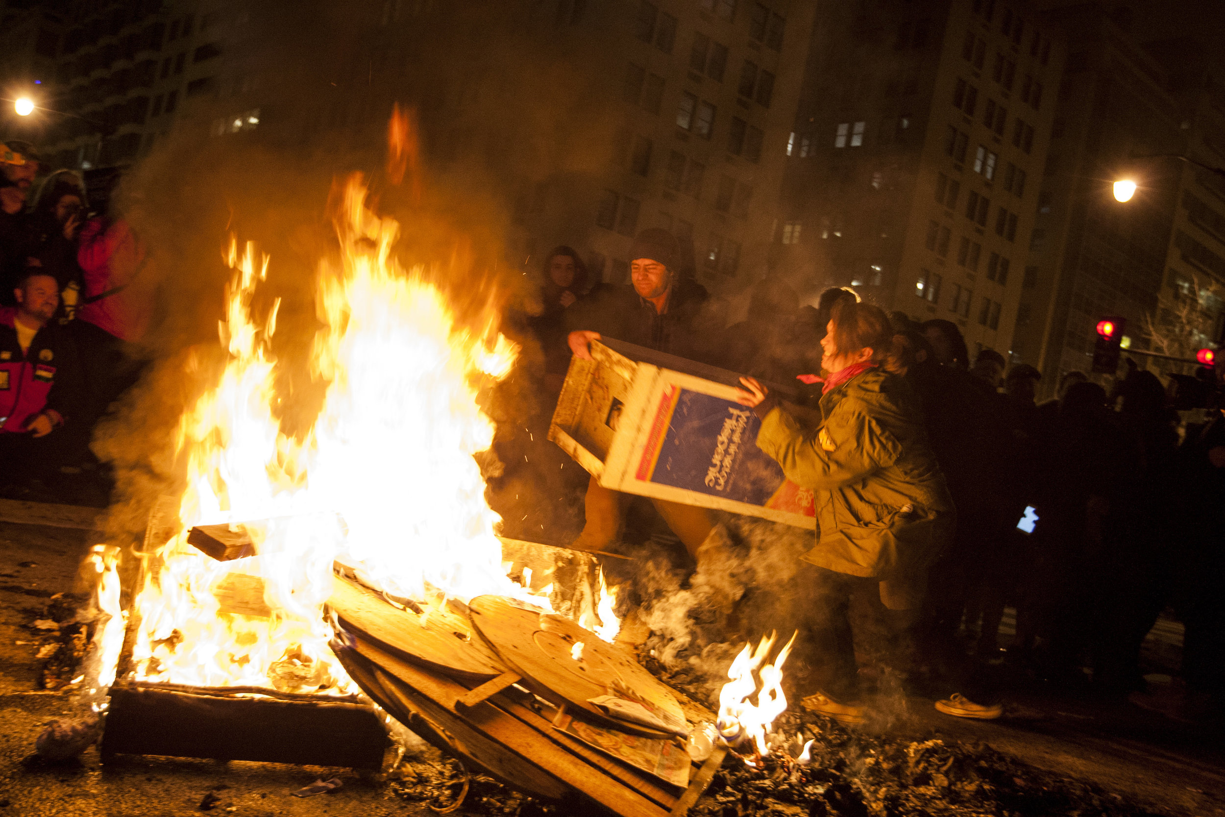  Protesters throw a newsstand on a fire near the intersection of K and 14th streets in Washington, D.C., following the inauguration of Donald Trump on Jan. 20, 2017. 