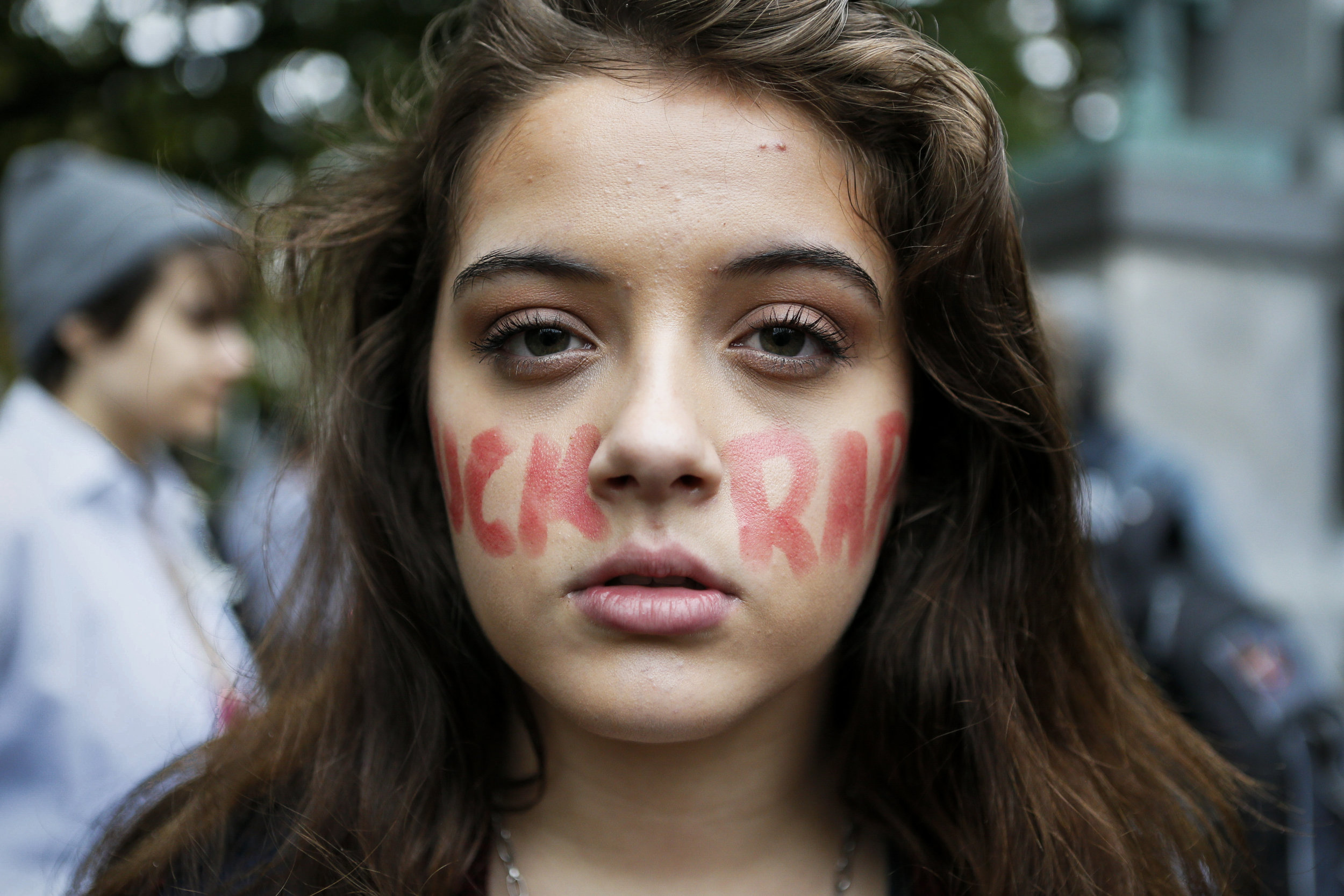  Carly Preston, a freshman studying political science and journalism, displays her facepaint after the FuckRapeCulture march on Friday, Oct. 10, 2014. FuckRapeCulture is a campus organization that seeks to raise awareness about rape culture at Ohio U