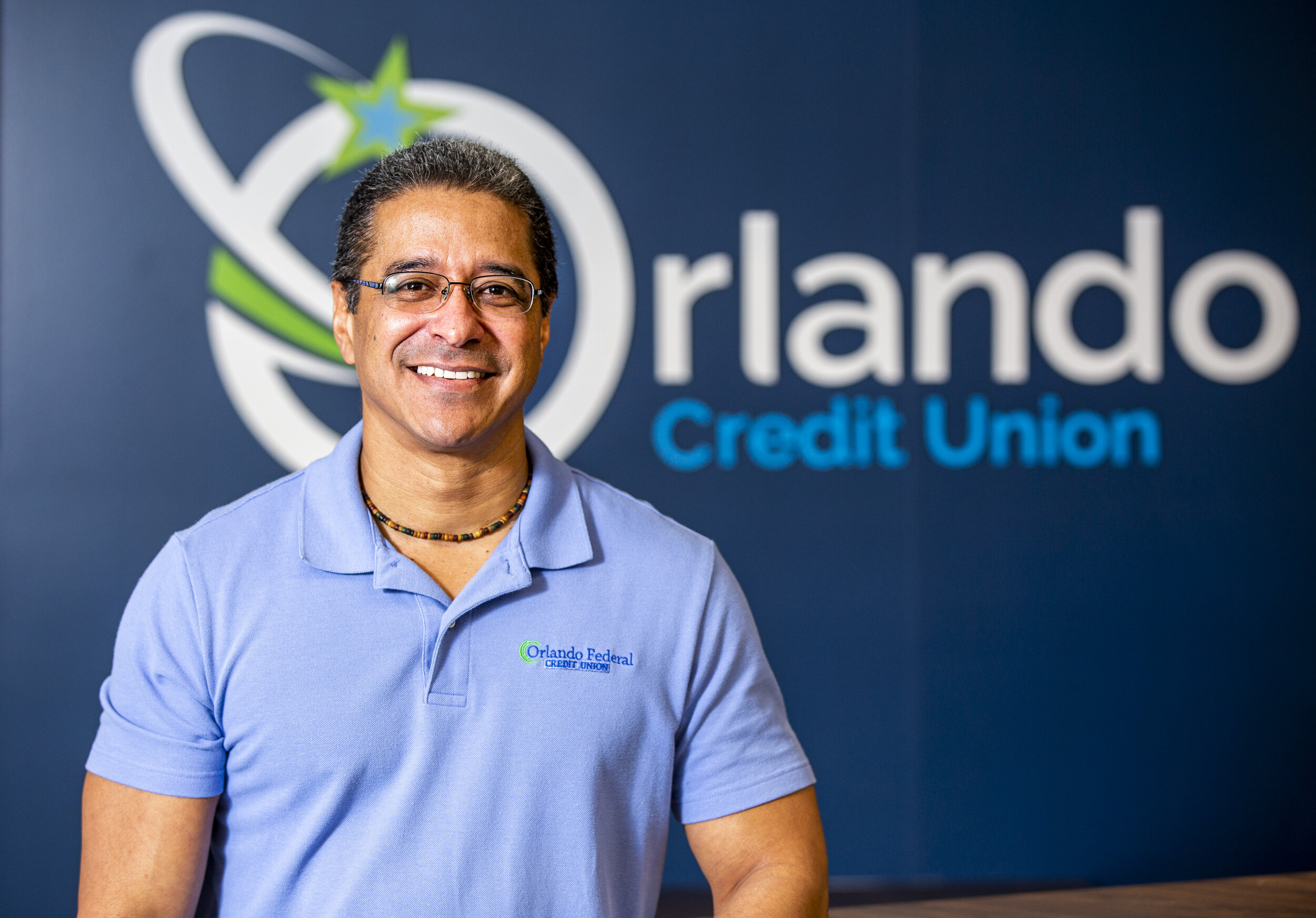  Omar Rosario, a banker at Orlando Credit Union, said, "We're always talking about being prepared for a rainy day. ... This is a flood, pretty much. It's important for us to be here for our members and clients," at the bank's SoDo branch on Tuesday, 