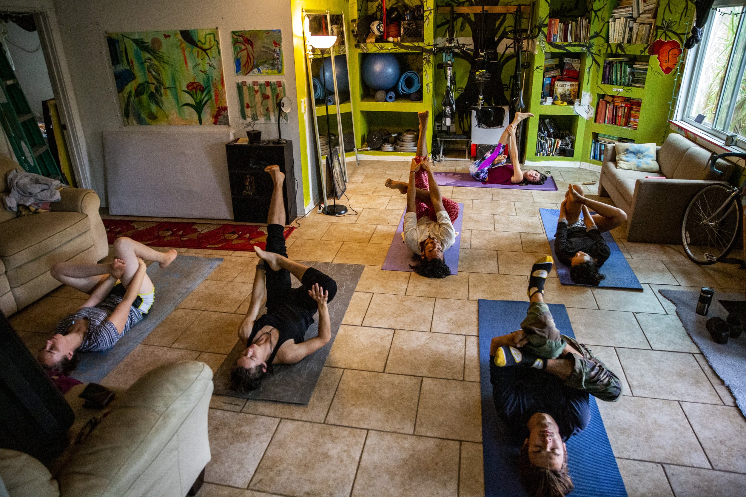  Co-op residents participate in yoga led by Amy Green at the Peanut Butter Palace co-op in East Orlando on Thursday, Jan. 24, 2019.  