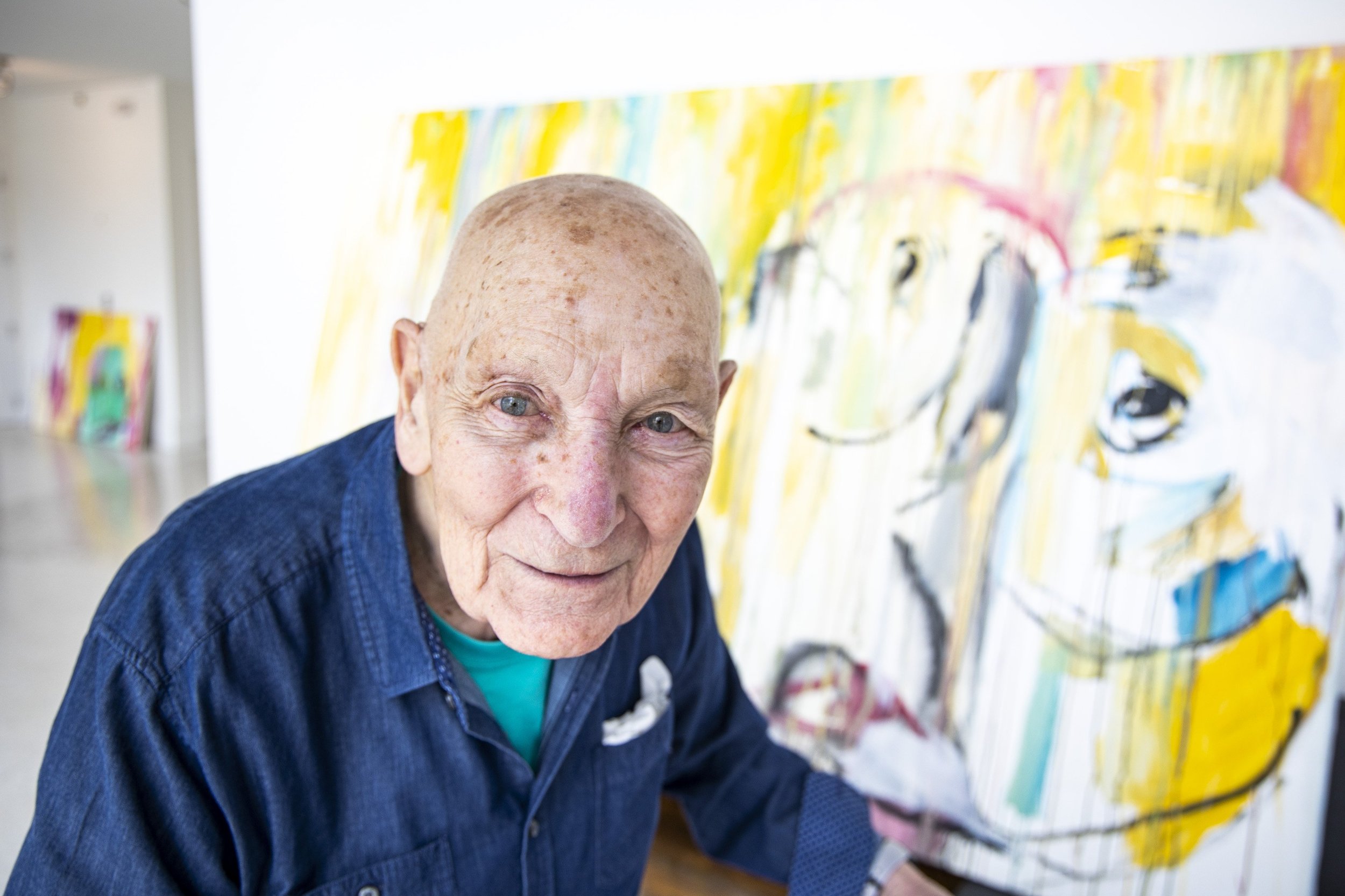  Harold Garde, 98, stands in front of one of his paintings in a new exhibit titled “They Art Us” at the Mills Gallery in Orlando on Monday, Aug. 2, 2021. 