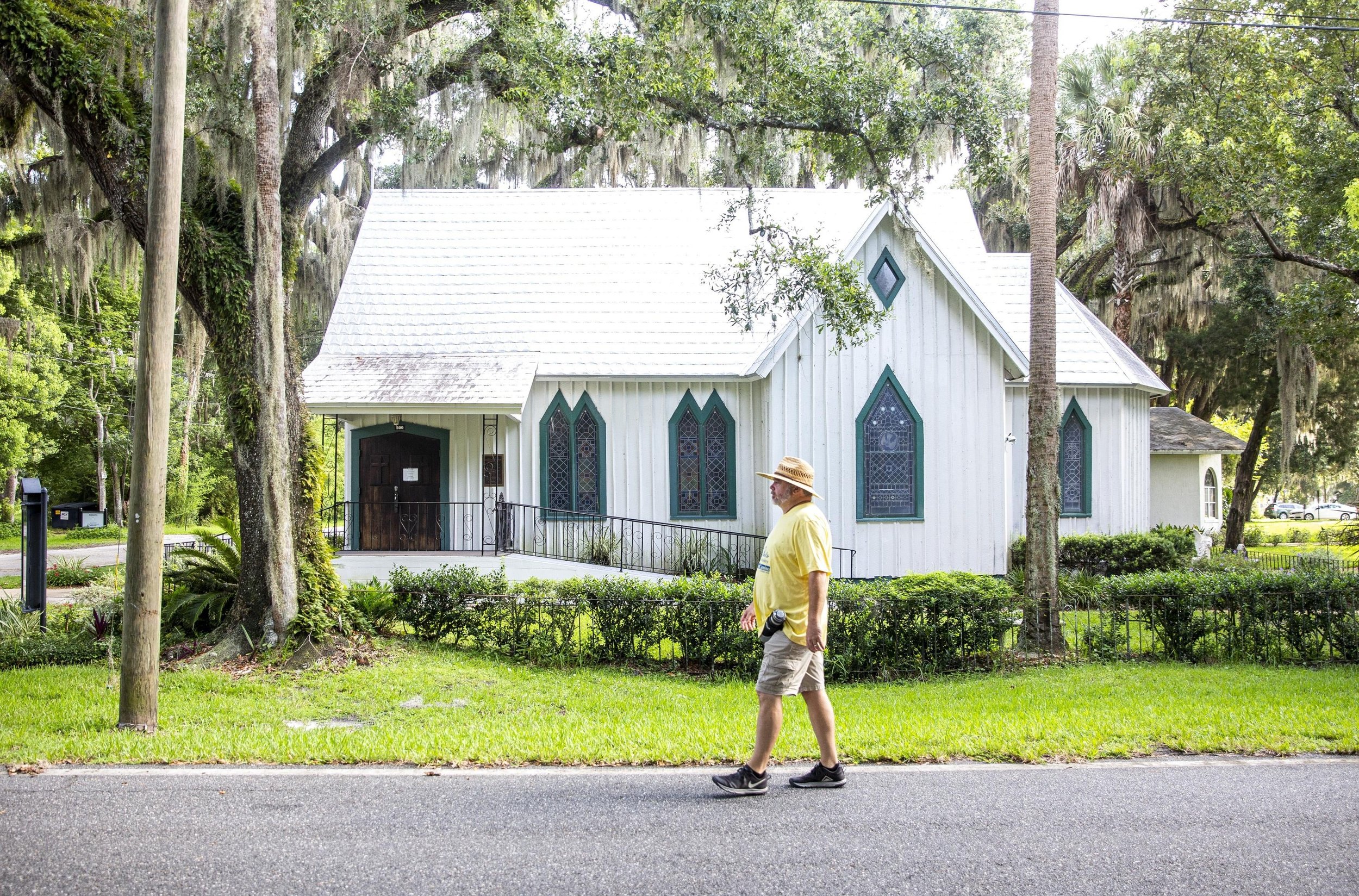  Riley Nutt walks through Enterprise and the All Saints Episcopal Church, of which he is a member, on Tuesday, July 14, 2020. The Enterprise resident is walking from Florida’s Atlantic to Gulf Coast to raise money for the Sao Paulo Mercy Ministry ben
