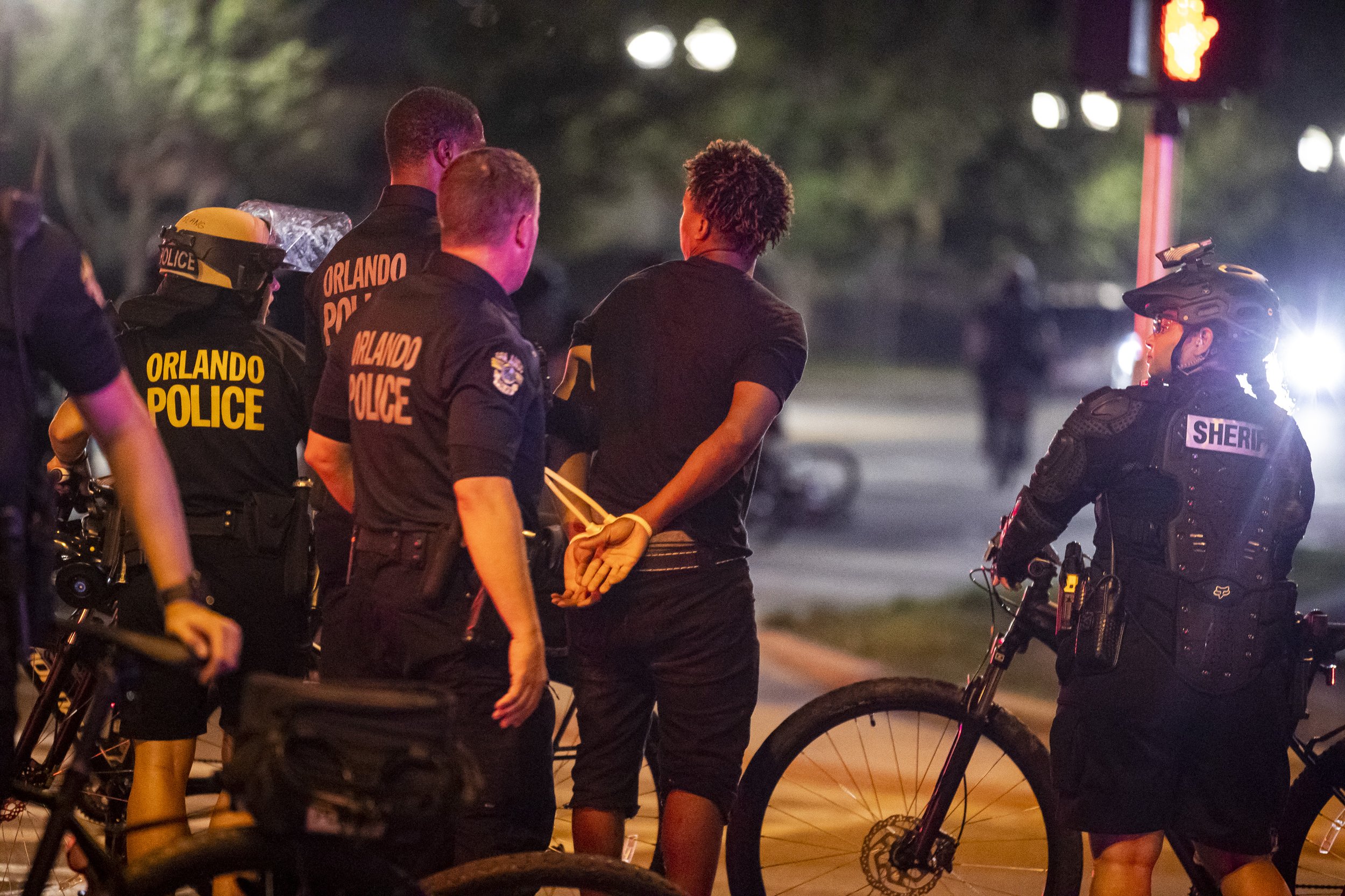  A protester is arrested after a 10 p.m. curfew following a demonstration demanding justice for George Floyd in Orlando on Sunday, May 31, 2020. 