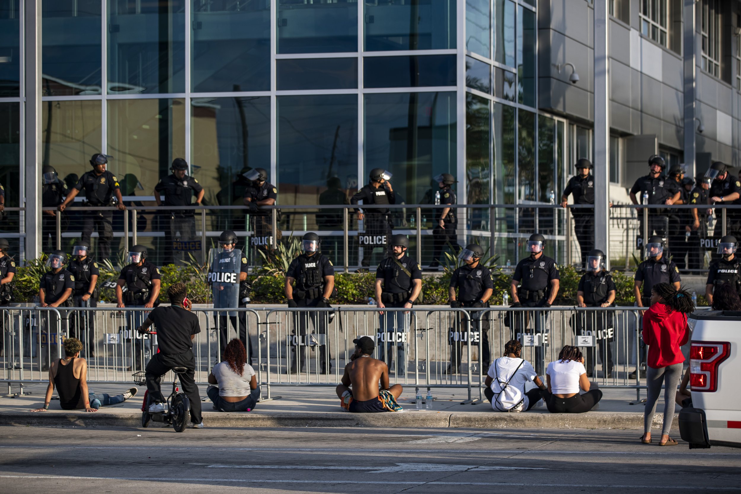  Protesters sit outside of the Orlando Police Department headquarters in Parramore during a demonstration demanding justice for George Floyd in Orlando on Sunday, May 31, 2020. 