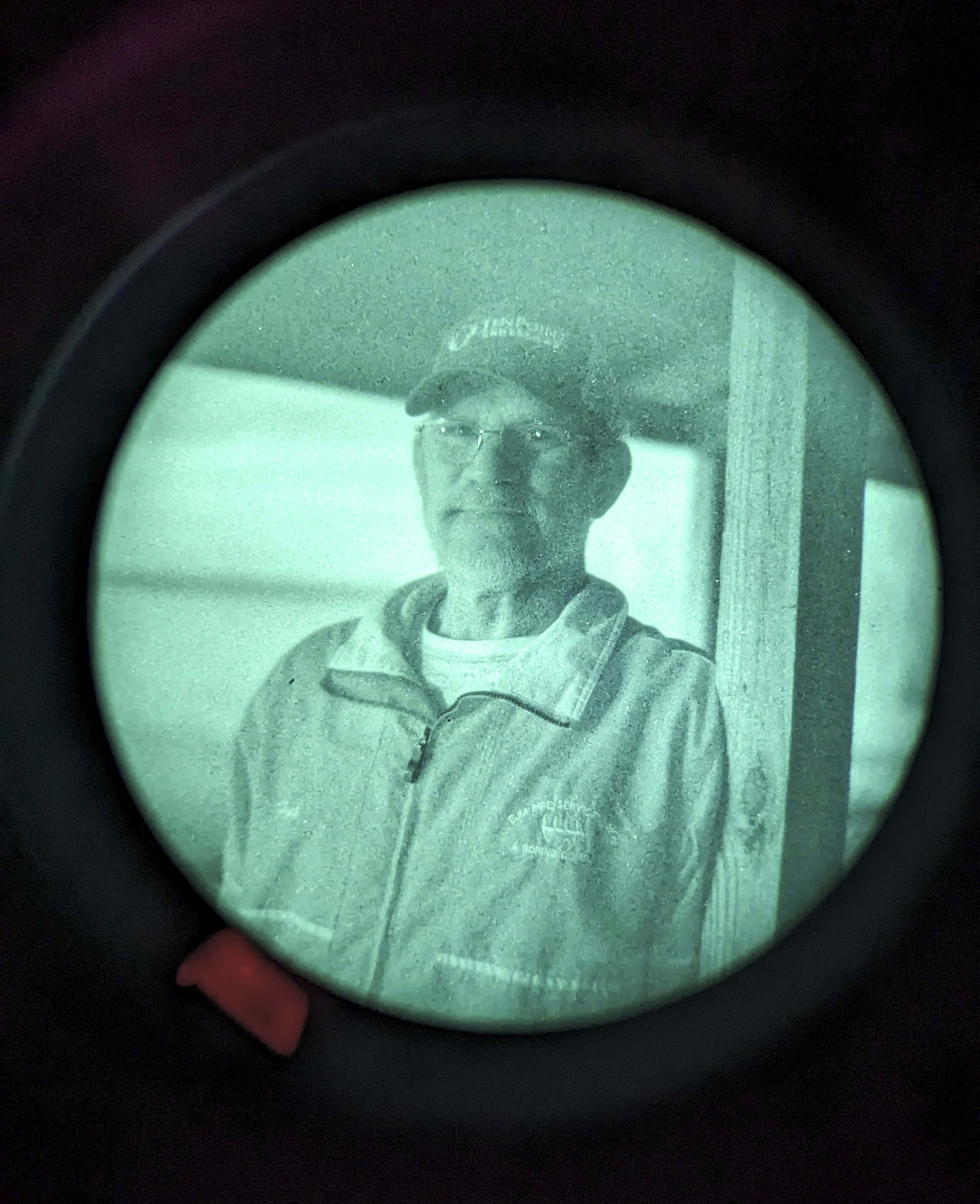  Fred Goebel is seen through a night-vision scope while setting up camp for the night during a kayaking trip on the St. Johns River. 