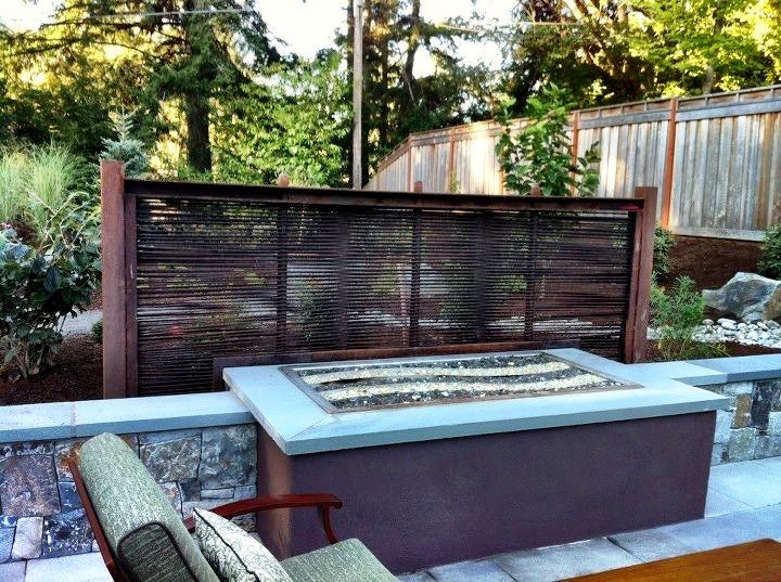 Rebar Screen with Corten and Stainless Fire Table with Lava Rock