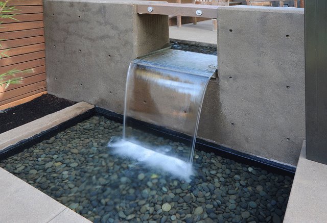 Open Top Stainless Steel Spillway in Concrete Wall