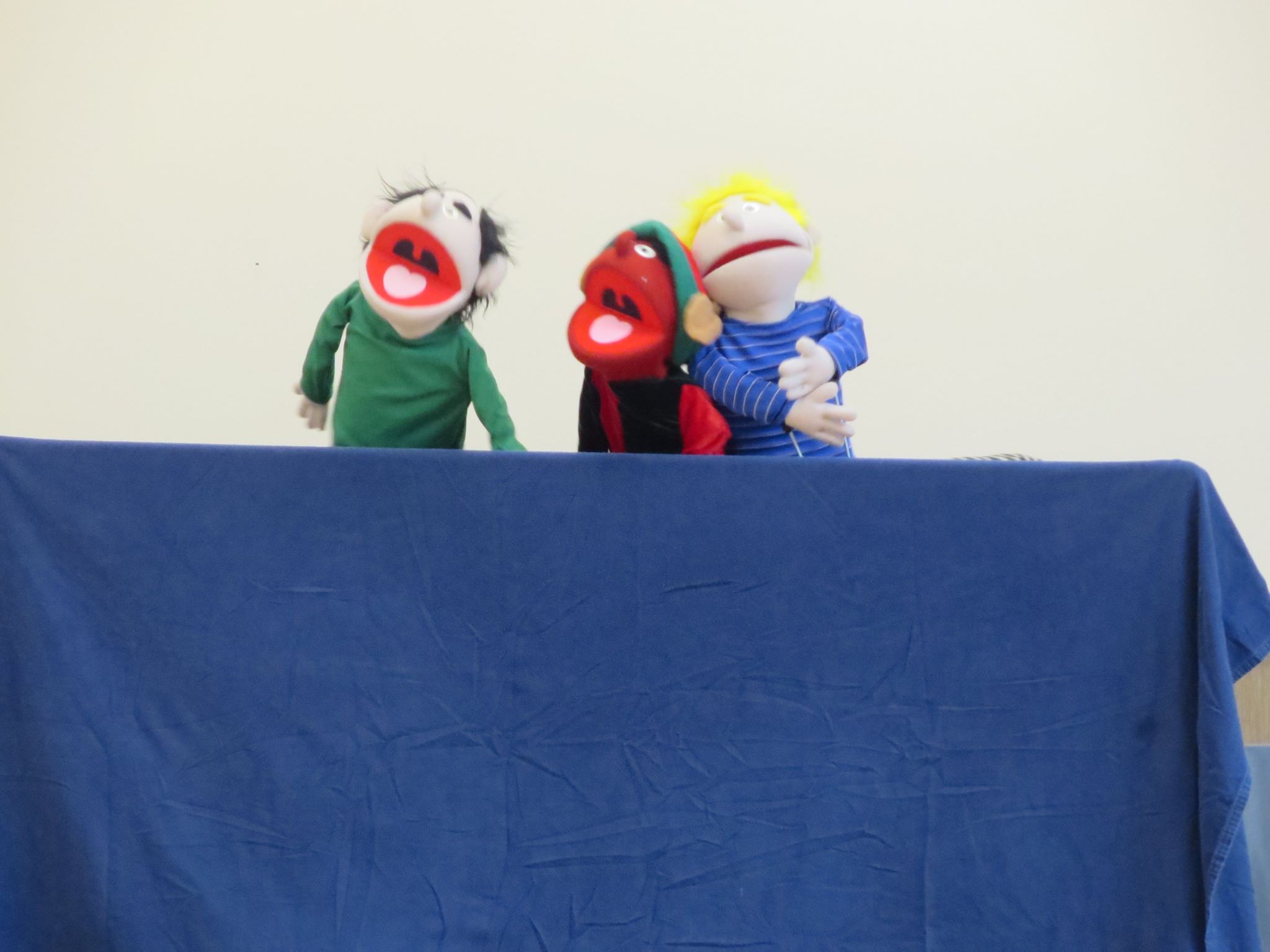 Putting on a puppet show.