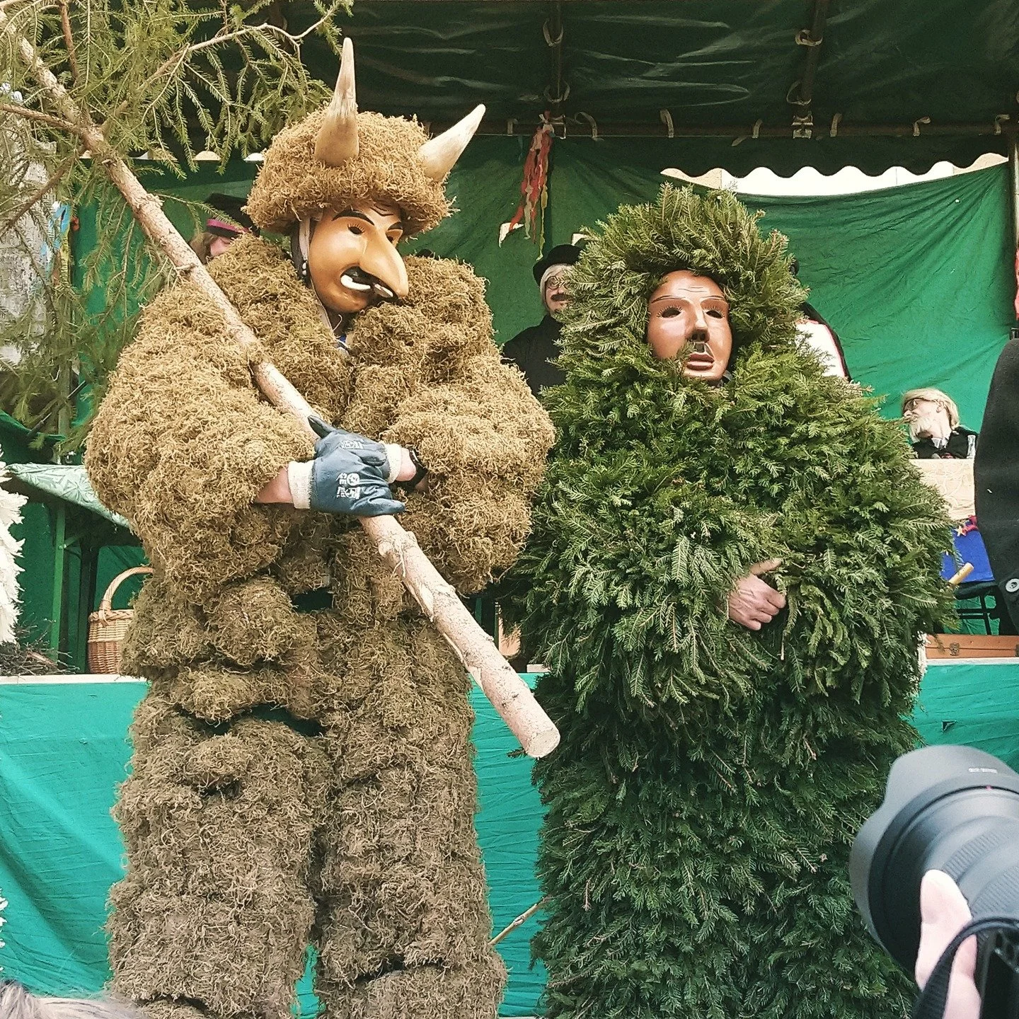 &quot;The Baker leads. He wears a dour mask with heavy eyebrows
 and moustache, and he is outfitted in the whites 
and toque of his profession. He carries a long peel, the
 sort of thing for sliding loaves out of the oven, and on 
its paddle is inked