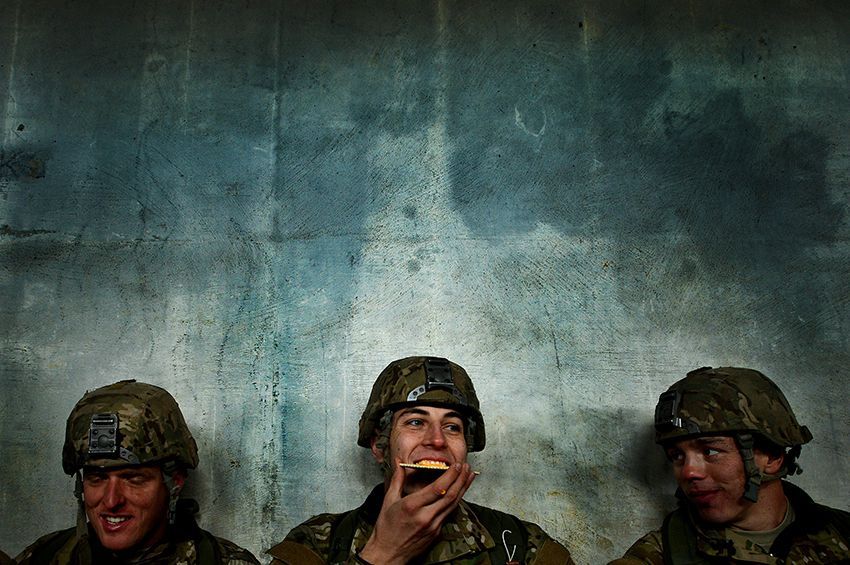1st place in the Combat Training category: U.S. Air Force Combat Control trainees assigned to Operating Location C, 342nd Training Squadron, laugh with each other while sharing a meal during a long day of training on Feb. 13, 2015. Working as a team and keeping morale high within the unit is vital to each airman’s success as they push through training. At the 342nd TRS both CCT and Special Operations Weather Team trainees go through four months of grueling tactical and classroom training. IMAGE: STAFF SGT. KENNY HOLSTON, USAF