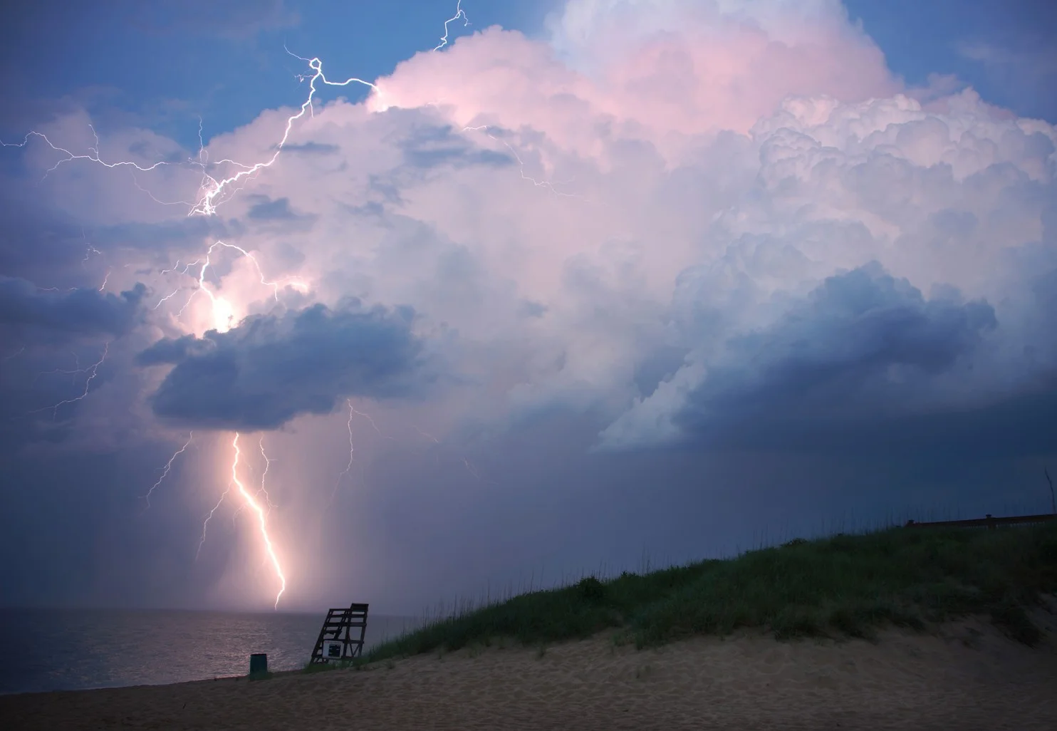 A small thunderstorm during sunset at Kill Devil Hills, North Carolina, June 12, 2016. Photo credit: Kevin Ambrose