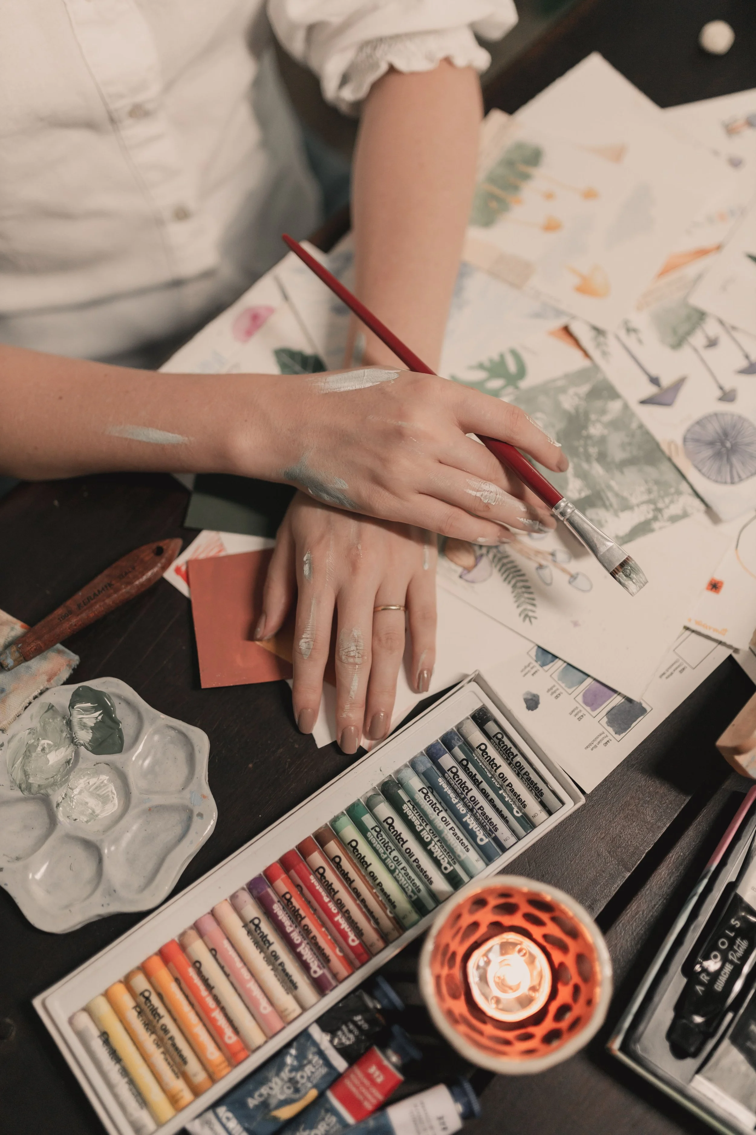 A person frantically trying to do multiple art projects at once in the middle of the night.