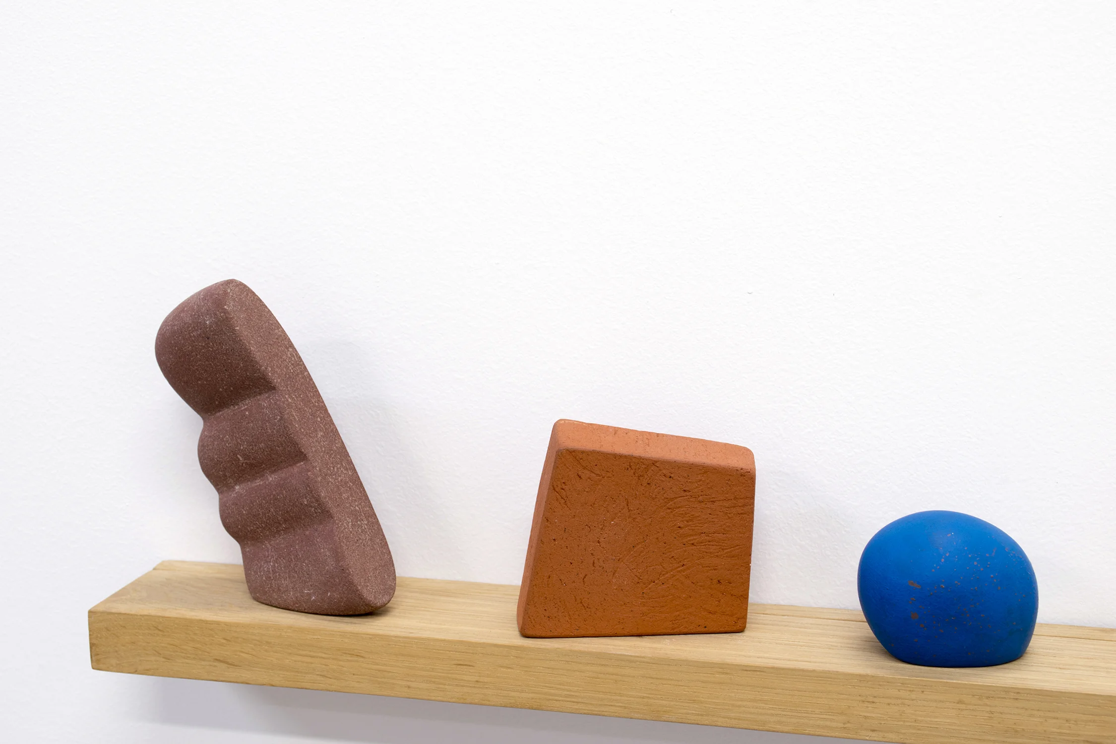 Three & Three, 2017 7 x 32 x 3 inches ceramic, wood, epoxy putty, sand, and gouache