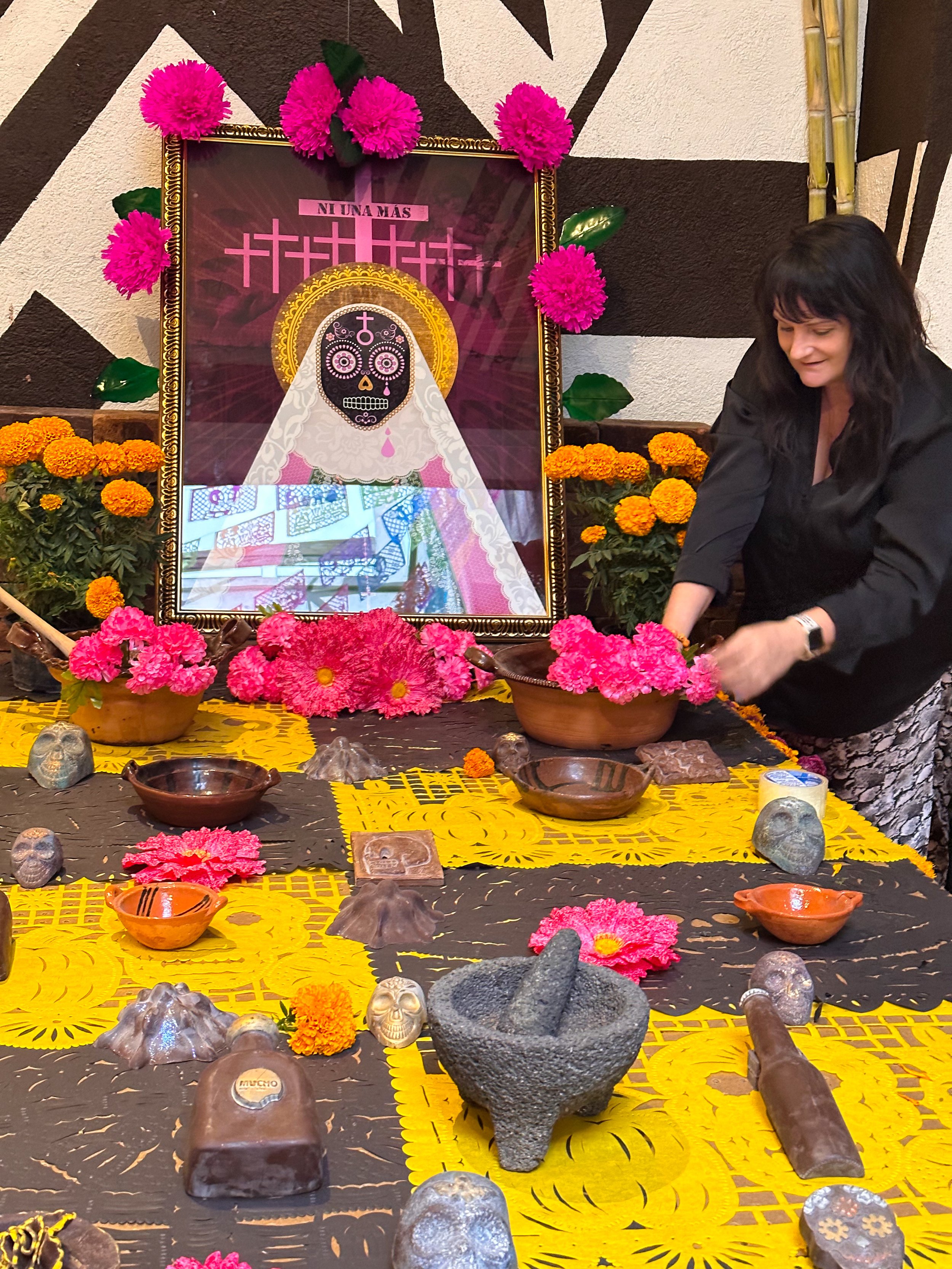 Finalizing the 'Dia de los Muertos' altar in Mexico City.
