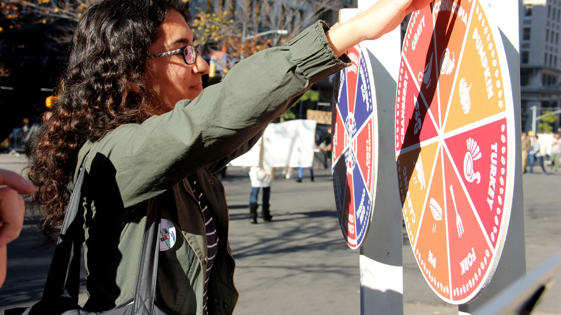 Woman spinning a prize wheel