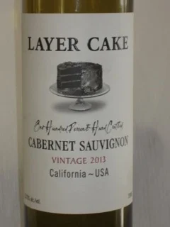 Layer Cake Cabernet Sauvignon ($13) Don't let the chocolate cake on the label fool you. This is a serious wine, from a serious wine maker. Jason Woodbridge is the owner of Hundred Acre. His 2012 Hundred Acre Cabernet Sauvignon received Wine Spectator's 94 point rating and is a $450 bottle of wine! He is also the owner of Layer Cake stating that he "Likes the idea of a young man putting 20 bucks on the counter and getting some change back on a good wine." This California Cabernet Sauvignon is a great value and well worth trying. Enjoy!