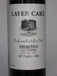Layer Cake Primitivo ($13) This wine from Puglia Italy is a Primitivo, but as stated in the blog, is also allowed to be labeled as a Zinfandel by European laws. This is a very accessible Italian Primitivo that is made very much in the style of California Zinfandels. It has nice bright fruit and a smooth finish, with just a hint of earthiness and minerals from the ancient seabeds of Puglia Italy.