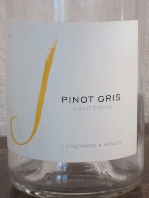 J Vineyards 2014 Pinot Gris ($14) This Pinot Gris ( pee-no gree ) from J Vineyards has light and delicate fruit flavors of lime, pear and pineapple. Pinot Gris, also known as Pinot Grigio in Italy, has medium acidity. In the USA, Pinot Gris is typically described as fruity and dry as compared to the Italian version that has more mineral flavors. Chill this wine and enjoy it with soft, light cheeses, fish and chicken.