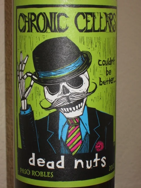 Chronic Cellars — 2012 Dead Nuts Red Blend ($18) Dead Nuts, out of Paso Robles, is a blend of 63% Zinfandel, 15% Tempranillo, 14% Syrah, 6% Petite Sirah and 2% Tammat. And, Wow, what a blend! This one was impressive right out of the bottle. Big expressive flavors and a smooth finish. Wish I'd picked up more than one of these!