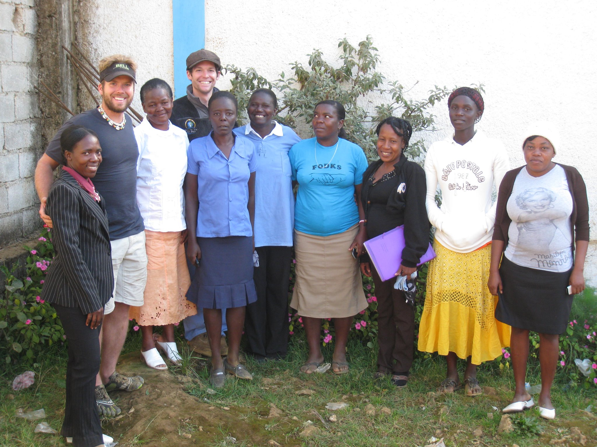 Clayton and Kyle pose with the team of Community Health Workers in Baie d'Orange