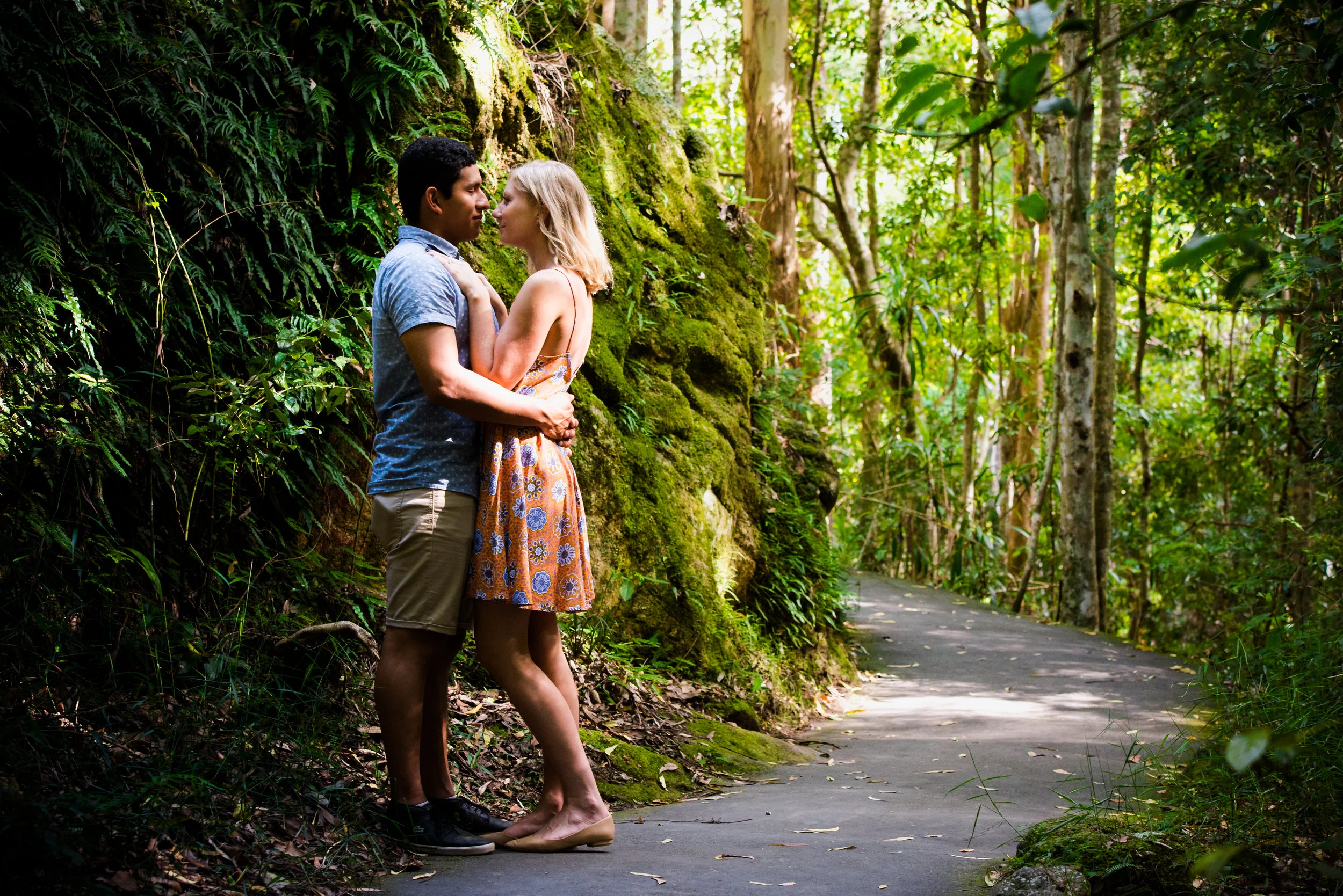 Engaged couple in rain forest