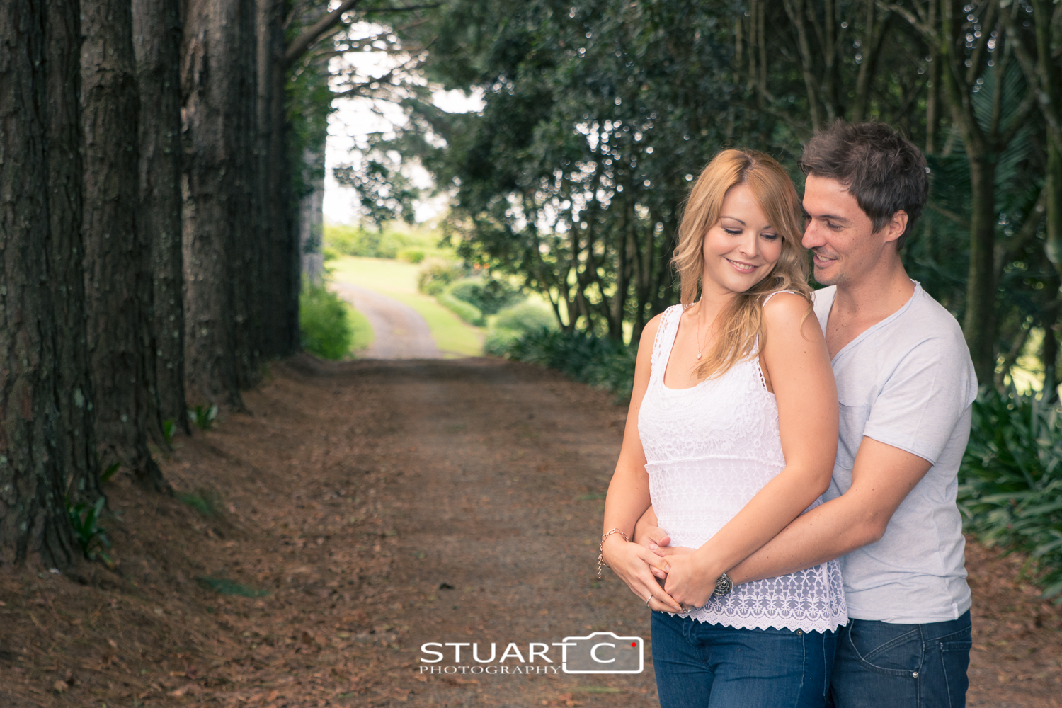 engaged couple on tree lined driveway maleny