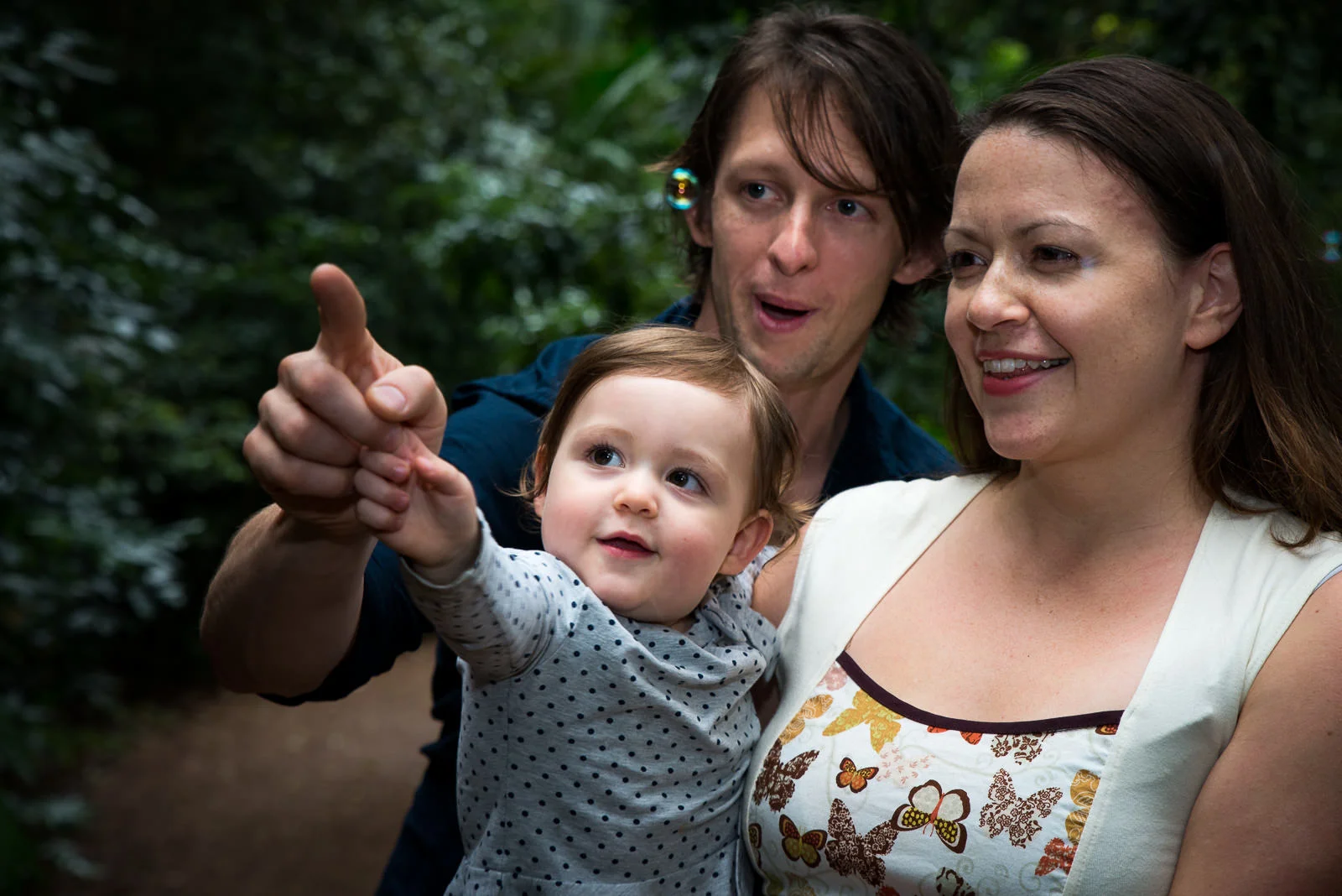 outdoor portraits of family playing with bubbles in rainforest setting at Mary Cairncross Park Maleny