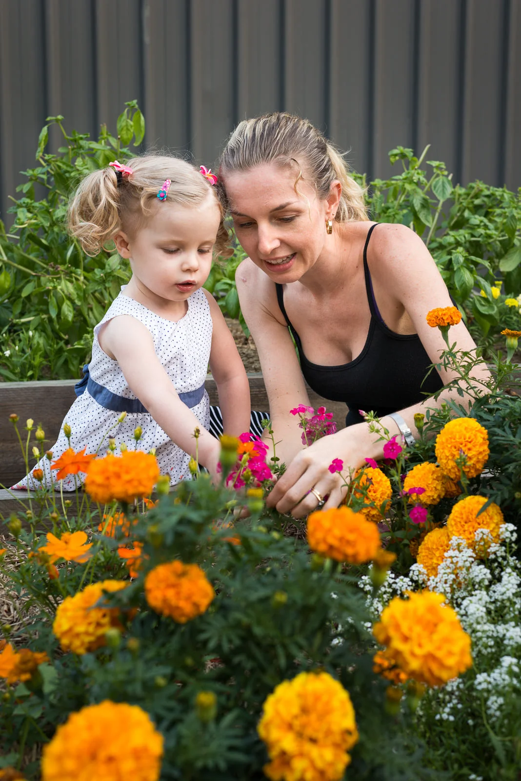 outdoor family portrait of mum and daughter in backyard garden at home in Elimbah