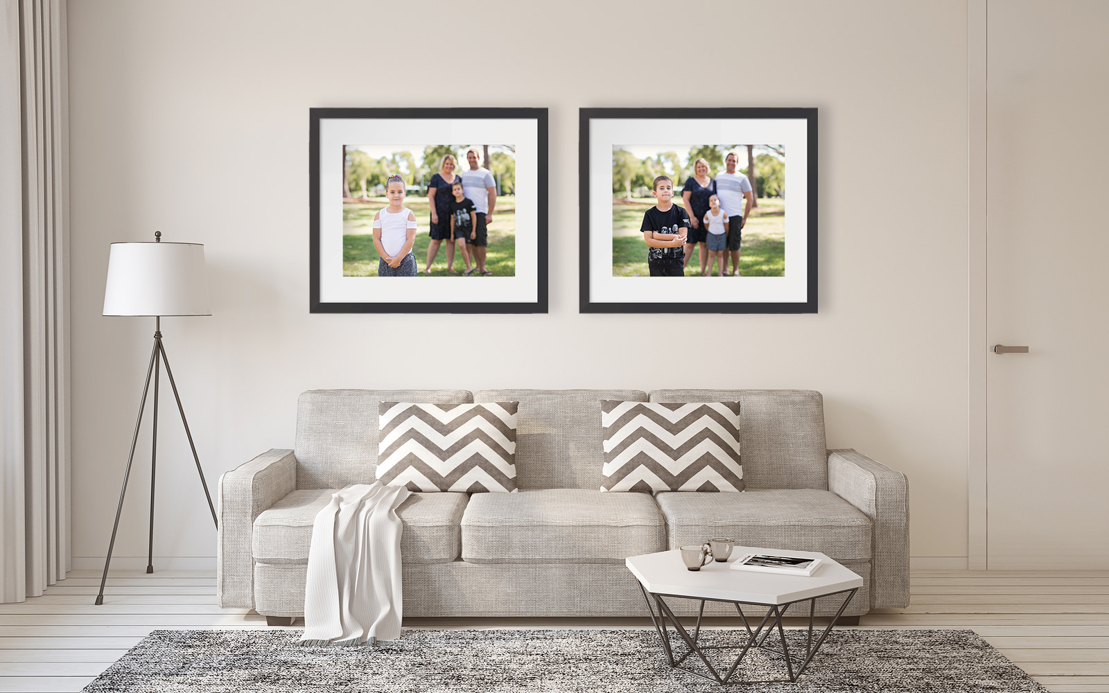 Framed family portraits on wall above couch
