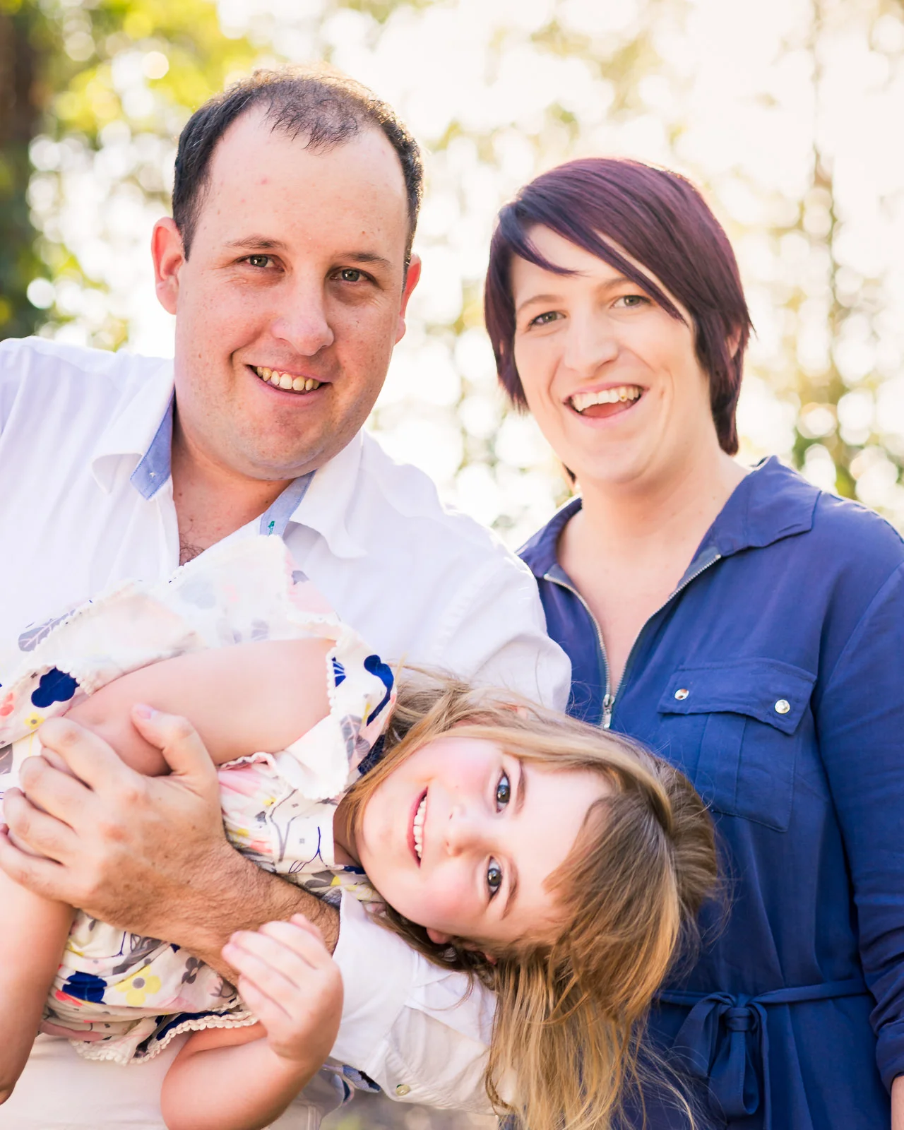 fun outdoor family portrait in garden setting