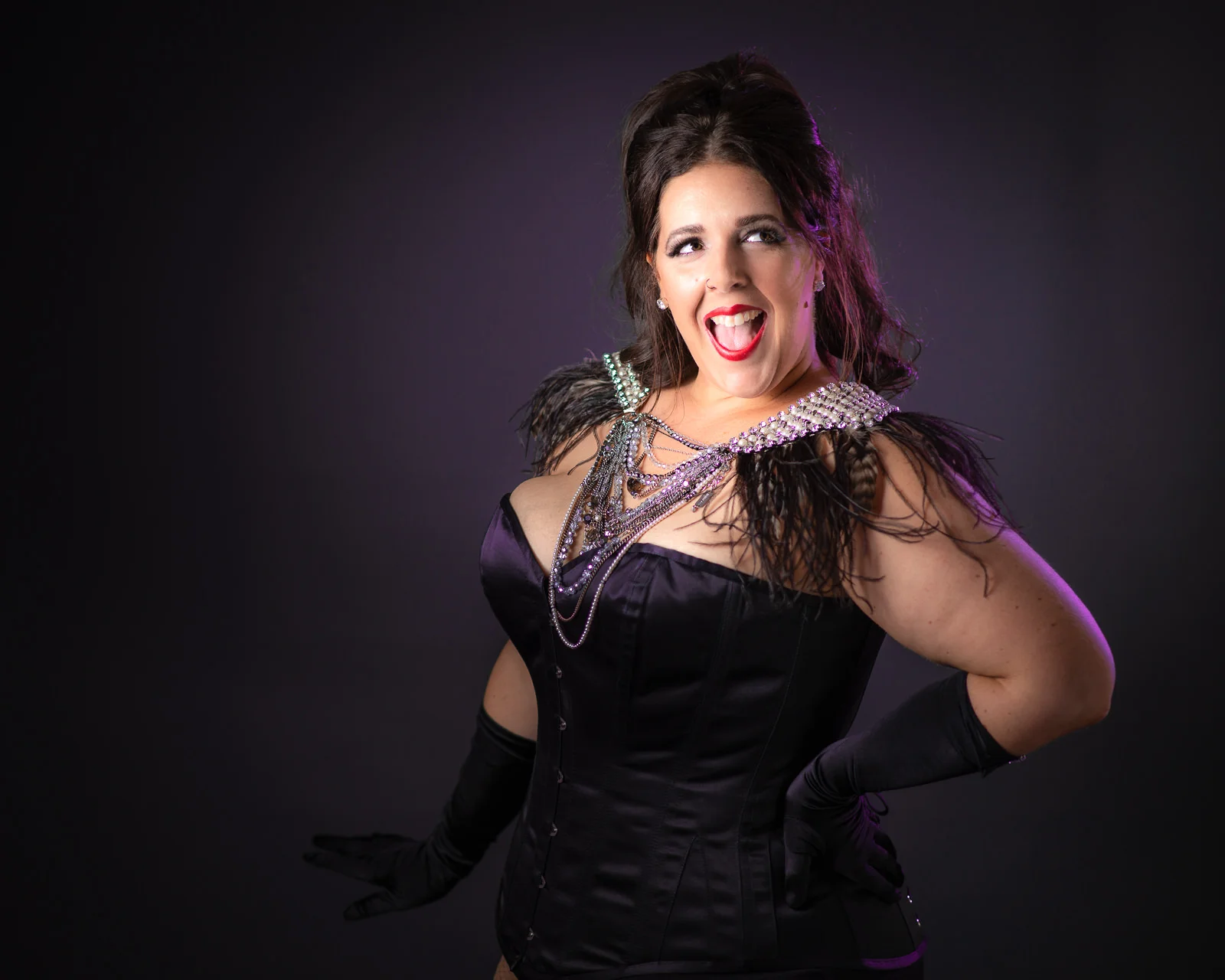 Cora Confetti burlesque performer with Bombshell Burlesque wearing black corset with mimco neck piece. Caboolture portrait photography