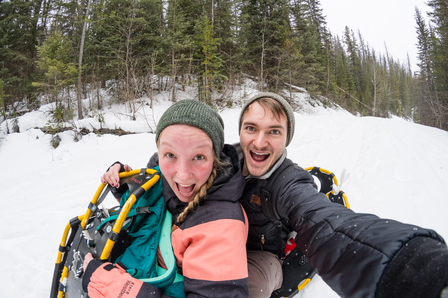 Riding a crazy carpet with Katie. A crazy carpet is basically a sheet of plastic with two holes at the front to dig your feet into. We hiked uphill and broke out the crazy carpet for the downhill sections of our hike to Wapta Falls.