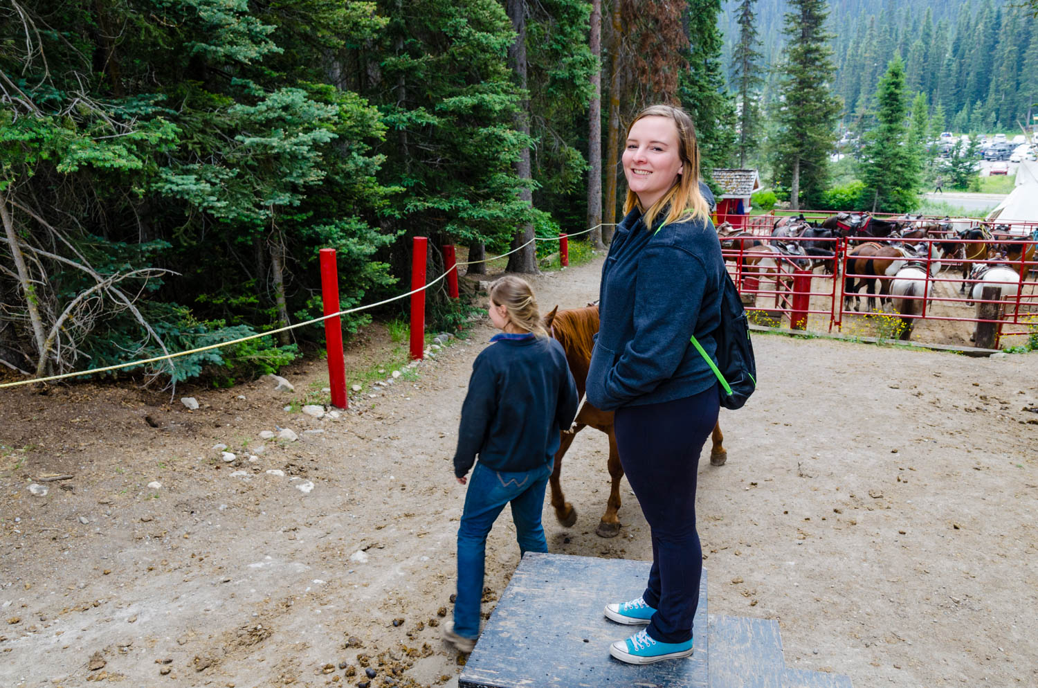 Erika waiting to mount a horse.