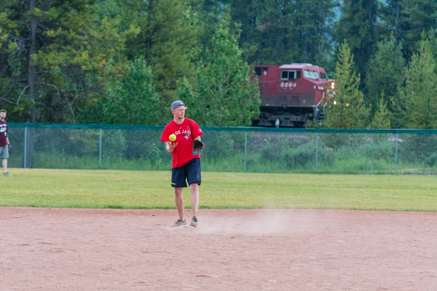 Action shot involving a train and softball. Not many photographers can deliver that!