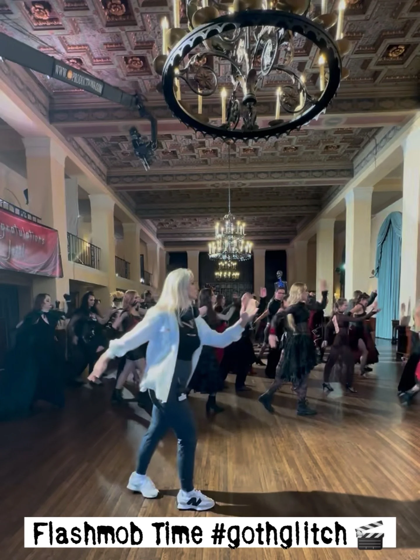 Flashmob vibesss #gothglitch IYKYK @murisaharba leading the cast in a rehearsal before the jib flies! @themandymcallister @chep2m @suzysevier @sabrina.smai @brooksgroupjax @kaciburger ☠️🕯️🎬🎥🎃🦇👑#choreographer #director #dancer #film #shakespeare