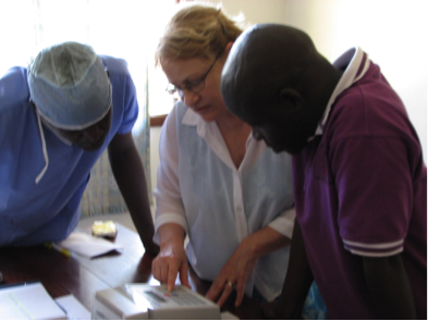 Training staff to use the new INR machine to monitor anticoagulation in patients in Congo.