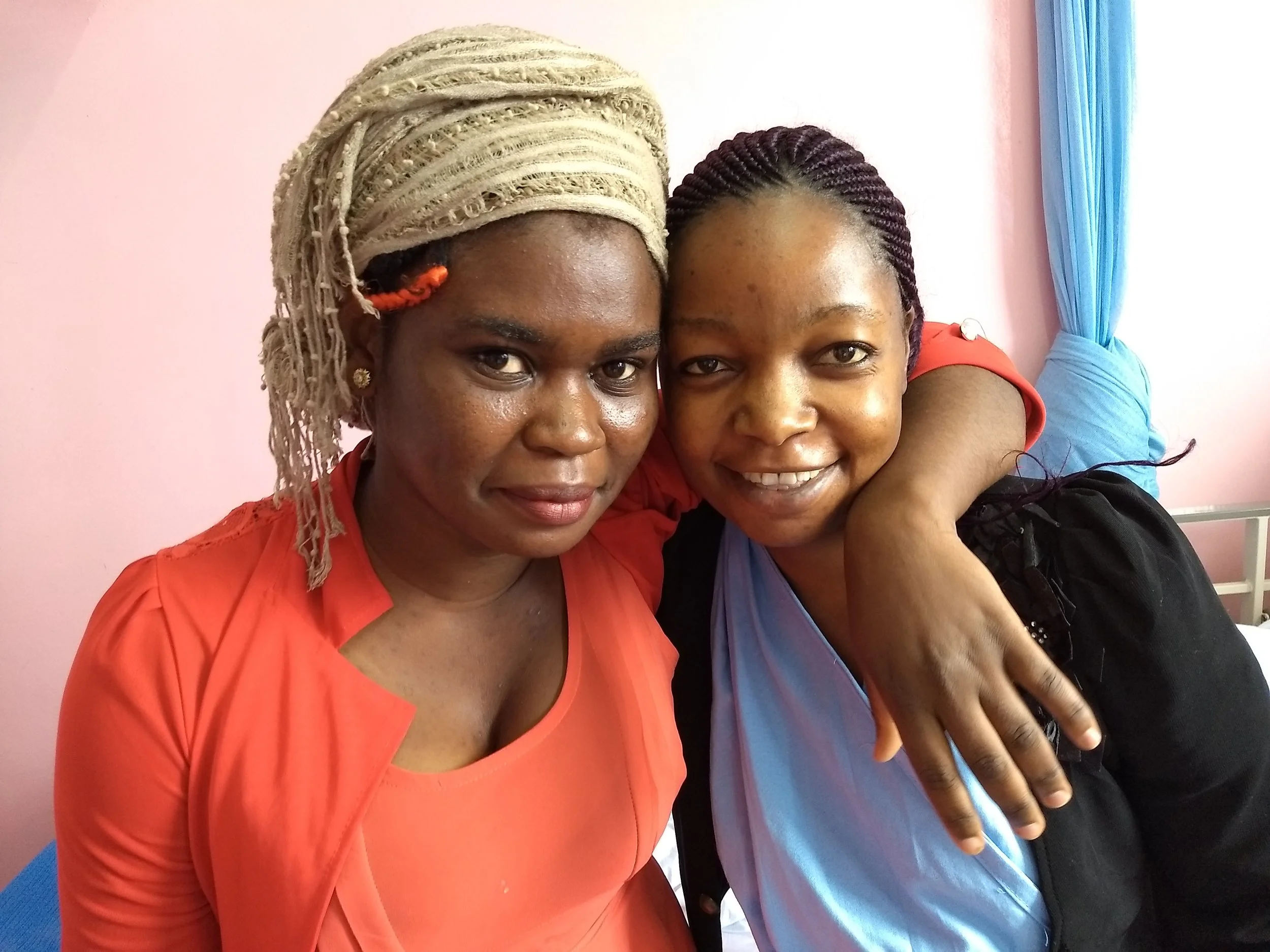 Patience (on the right) with her caregiver Christobel