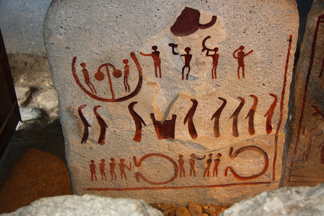 Image of a Bronze Age stone slab unearthed at the King's Grave in Kivik, Sweden. Wikimedia Commons. Note the beaked figures gathered around what appears to be a cauldron or bucket. Compare these figures to the bird-headed figure on the much later Golden Horn above.
