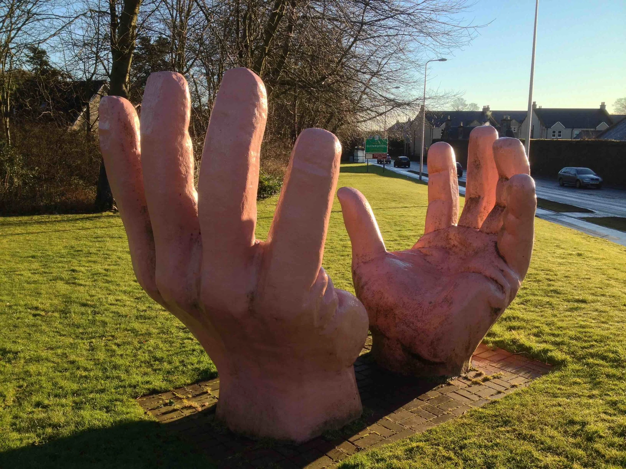 HANDS WITH ROAD IN BACKGROUND.jpg