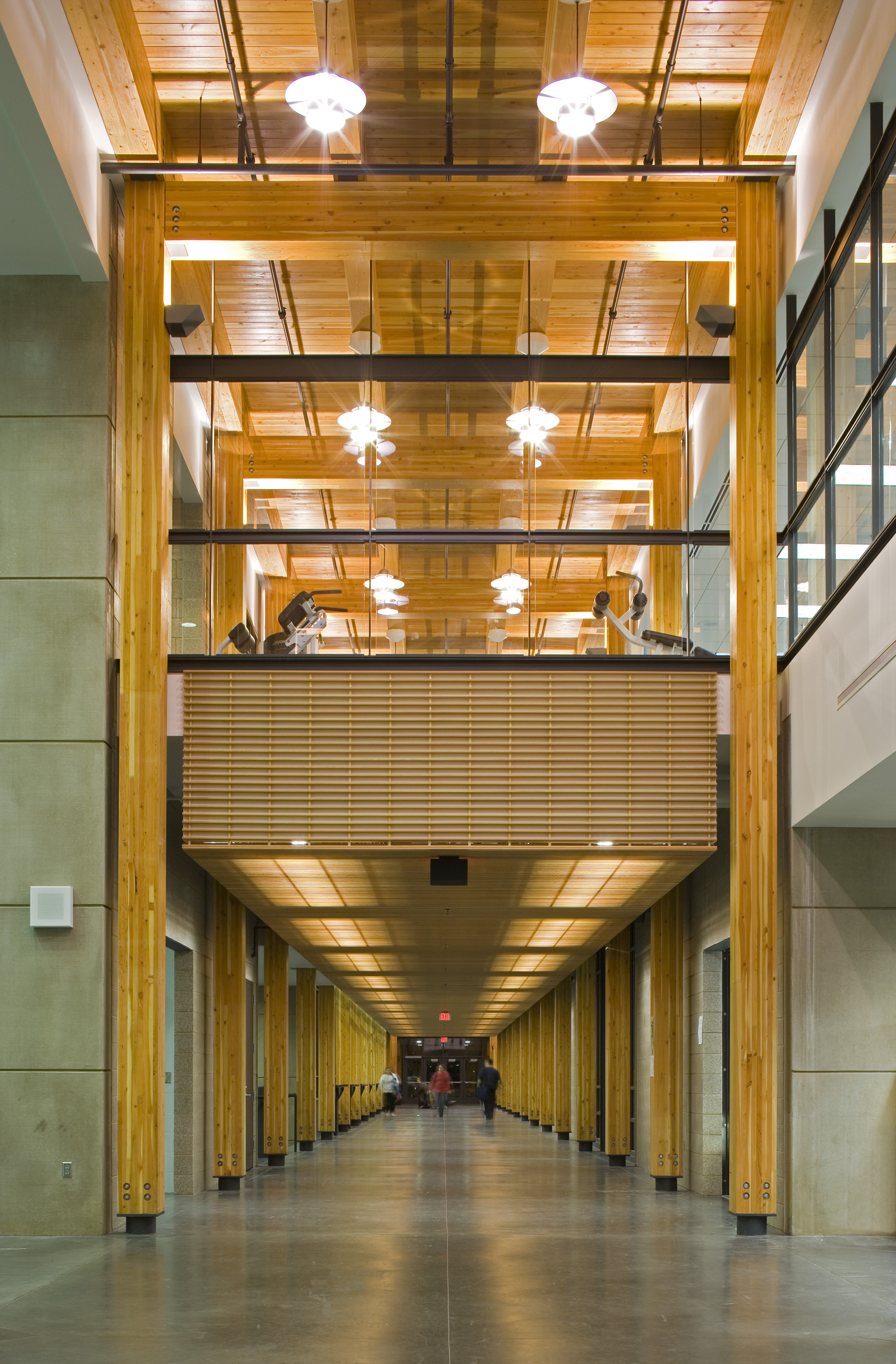 A warm lofty circulation spine, highlighted by two dozen timber frames, organizes the facility and acts as its 'main street'.