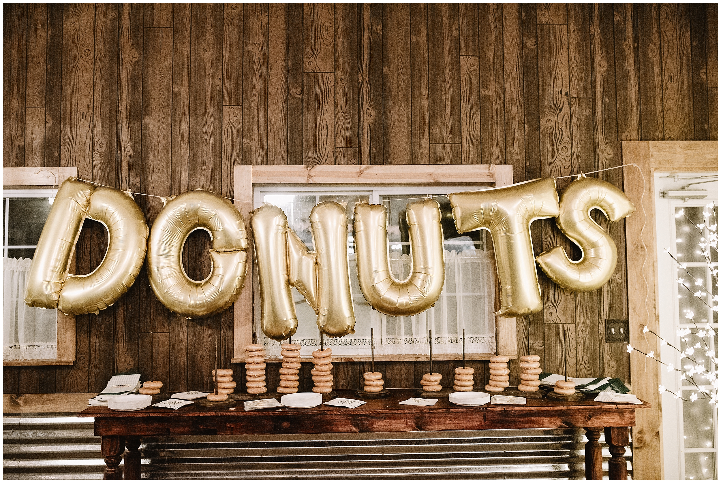 wedding photographer oklahoma reception decorations decor champagne table arrangements mr mrs mr. mrs. viola kansas rustic timbers donuts gold balloon dessert